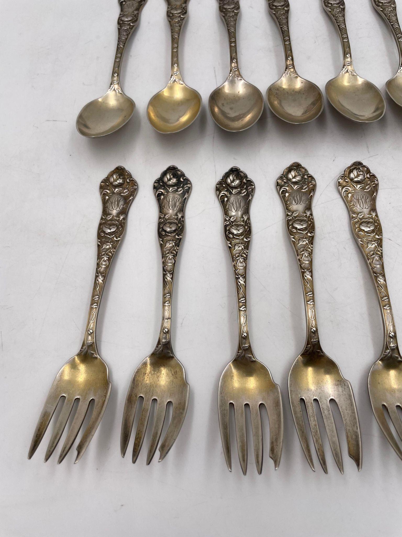 Shiebler sterling silver 24-piece flatware set in American Beauty pattern with original gilding. This set contains 6 cocktail forks with gilding (6 in), 5 dessert forks (6 in), 6 bowl table spoons with gilding (8.75 in), 6 teaspoons (8.75 in), and 1
