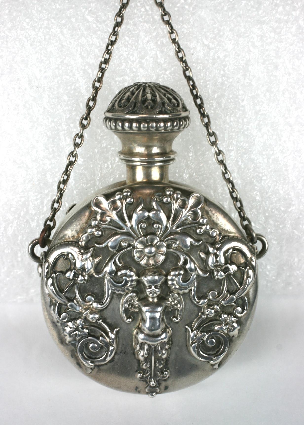 Shiebler Sterling Victorian Perfume flask pendant made originally for a chatelaine but can be used now as a pendant. It remarkably retains its original sterling stopper which is fitted beautifully. 
Ornate Rococo applications with angel, griffin and