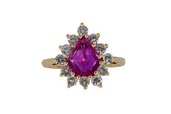 Shield-Cut Ruby and Diamond Starburst Halo Ring