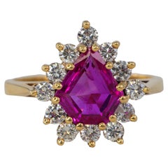 Shield-Cut Ruby and Diamond Starburst Halo Ring