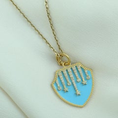 Shield Pendant With Star Designs & Turquoise Enamel Made In 14k Yellow Gold