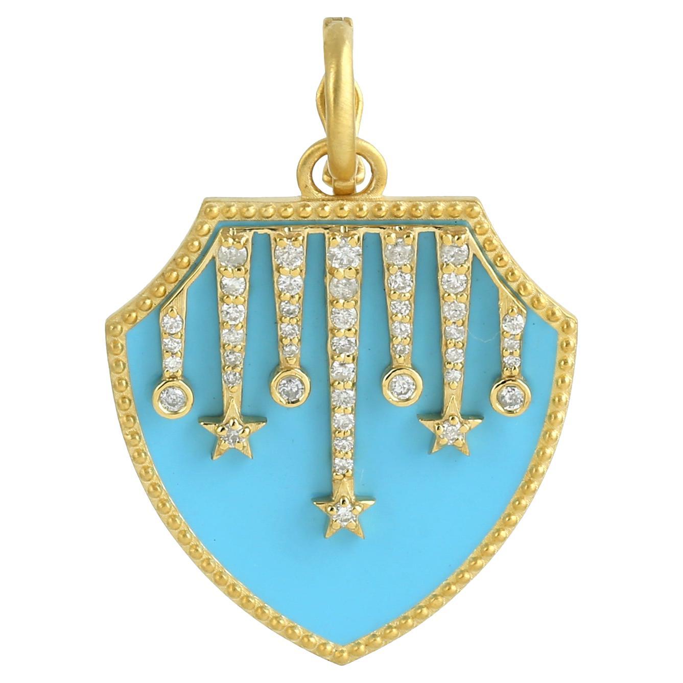 Pendentif bouclier avec motifs d'étoiles et émail turquoise fabriqué en or jaune 14 carats