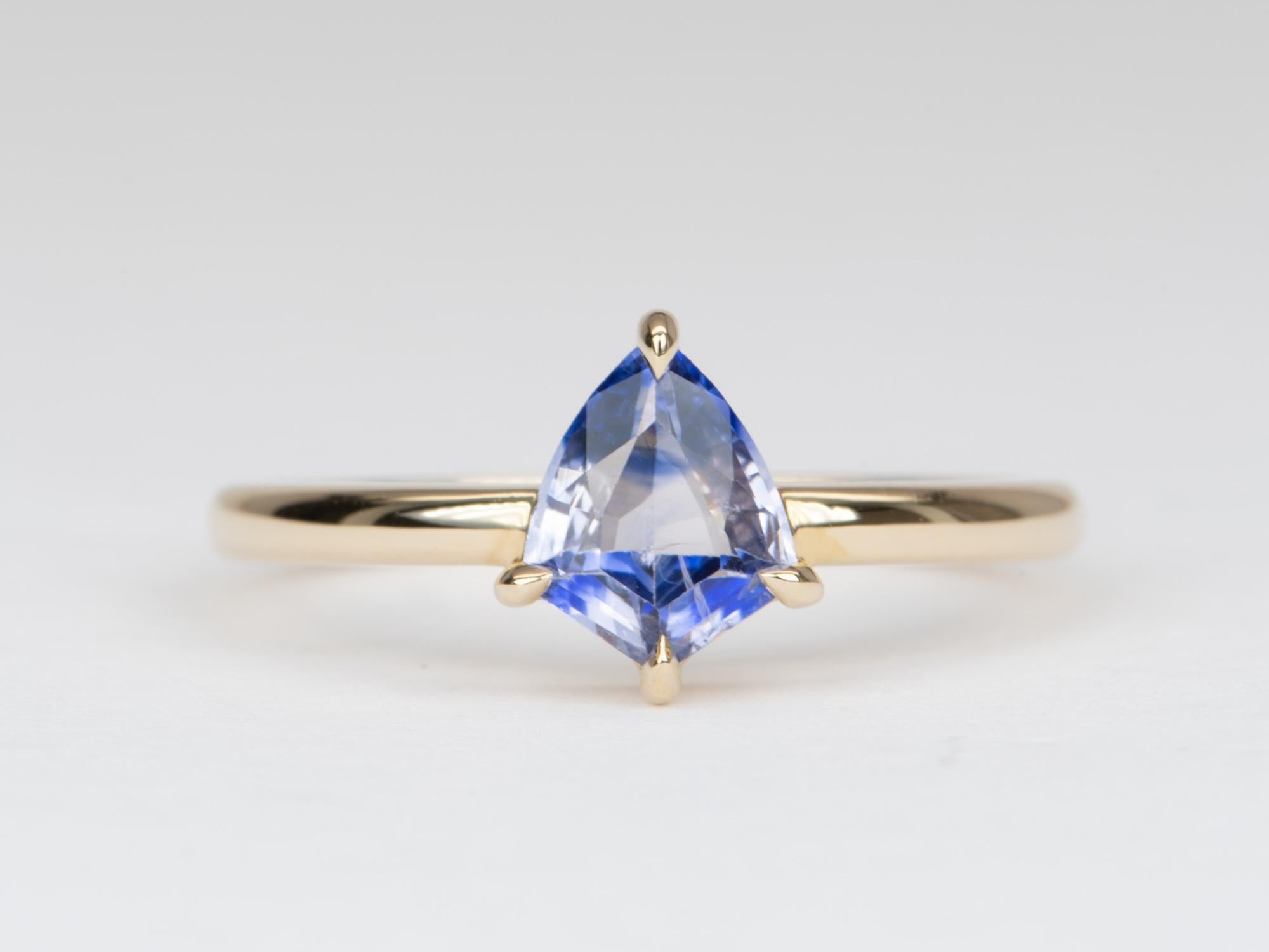 ♥ Solid 14K gold ring set with a shield-shaped bi-color sapphire
♥ It's a small but super unique sapphire, displaying great transparency and a blue purple color. One-of-a-kind stone and cannot be replicated!
♥ The overall setting measures 7.5mm in