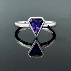 Shield shaped bezel set .90 carat purple sapphire and 14k white gold ring by G&G