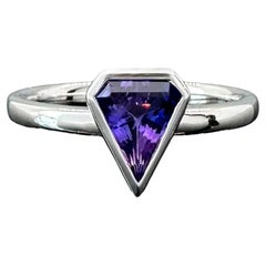 Shield shaped bezel set .90 carat purple sapphire and 14k white gold ring by G&G