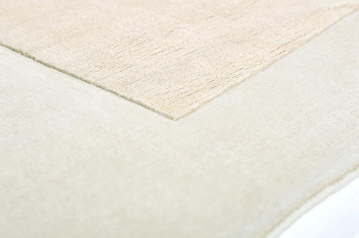 Handwoven of silk and wool, this piece is elegant and minimal with an unexpected asymmetrical border. Embossed detailing moves around the border with a soft neutral color palette creating a timeless appeal. 




Rug number 27900
Size 9' 0