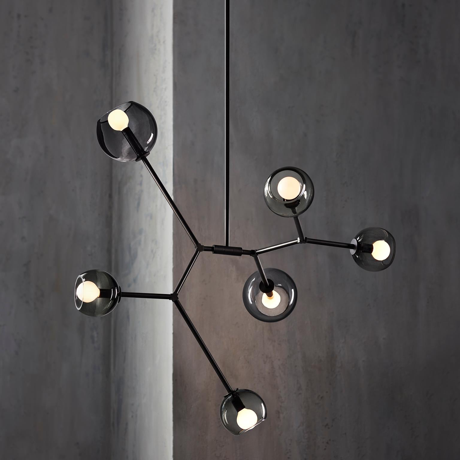 Shift embraces the air with a free floating form and open gesture. Blown-glass spheres balance vertically and horizontally creating a light, graceful composition. 

All of our fixtures are made by hand in Toronto, Canada.

UL, UL-C approved.