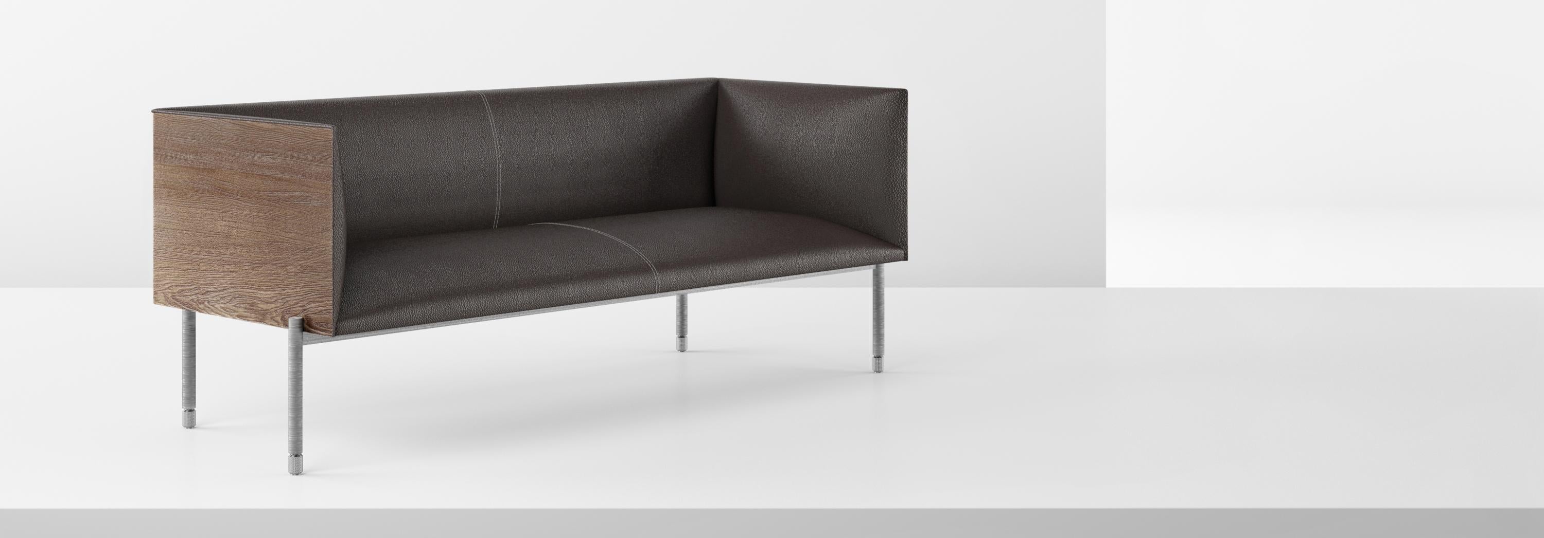 Shift is a series of products that owe their name to the metal leg system rotating around the product to provide support and make it float effortlessly. The seating unit is constructed with a sturdy wooden box that surround a curved leather