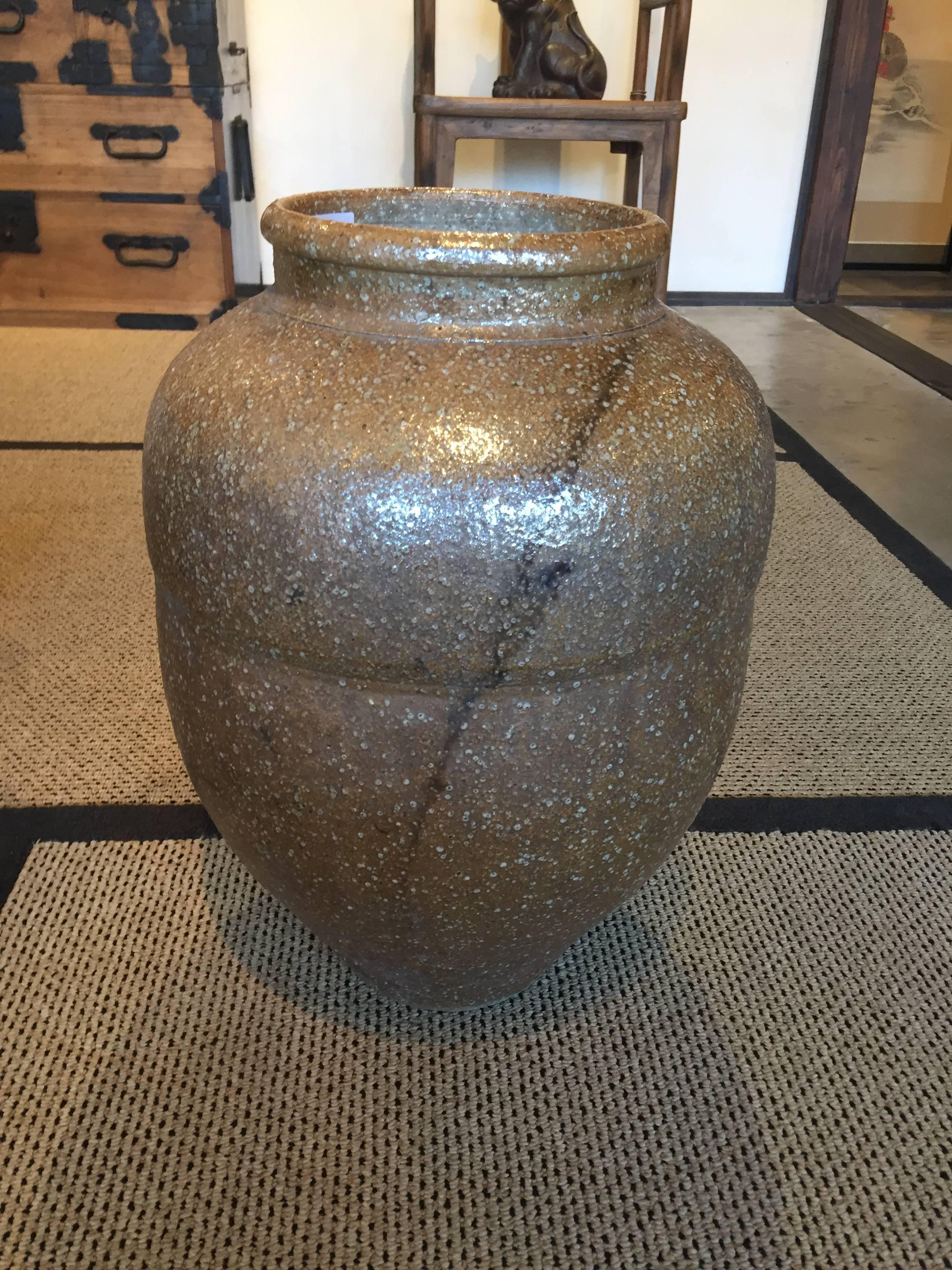 This is a shigaraki jar from Japan late Meiji period, circa 1900.
Shigaraki is a ceramic town of Koka City situated in the southern part of Shiga, and known as the home of Shigaraki ware. It has one of the six oldest kilns in Japan and is known