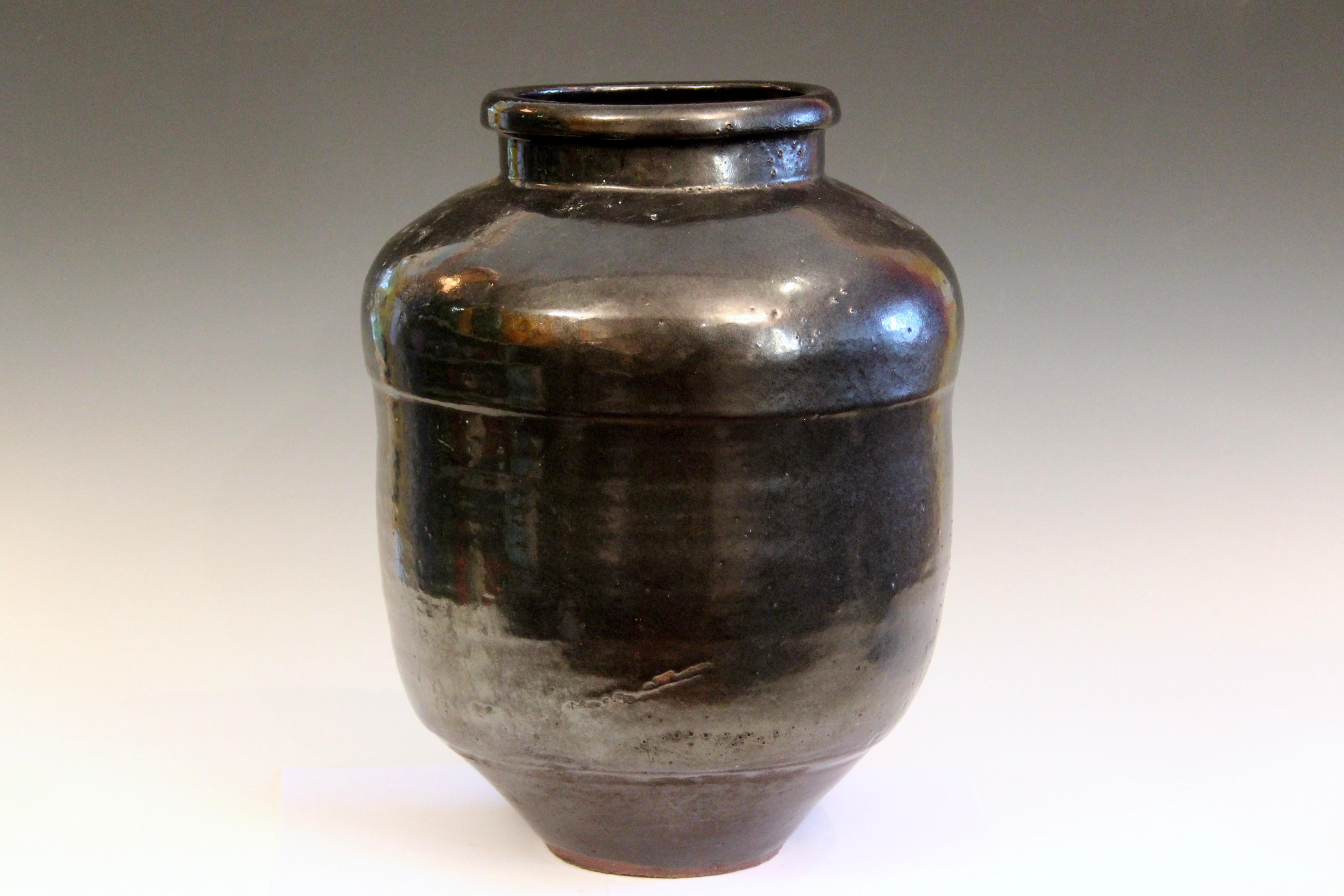 Vintage Japanese Shigaraki jar in shimmering metallic black glaze, circa early/mid 20th century. Measures: 16