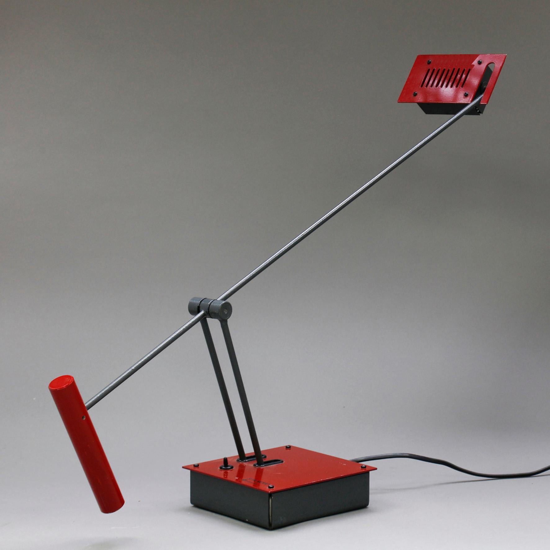 Shigeaki Asahara

Samurai

A black and red metal table lamp. The rectangular shape reflector on an articulated arm terminated by a counterpoise supported by a double stem on a square base.
Original edition by Stilnovo.
Italy,