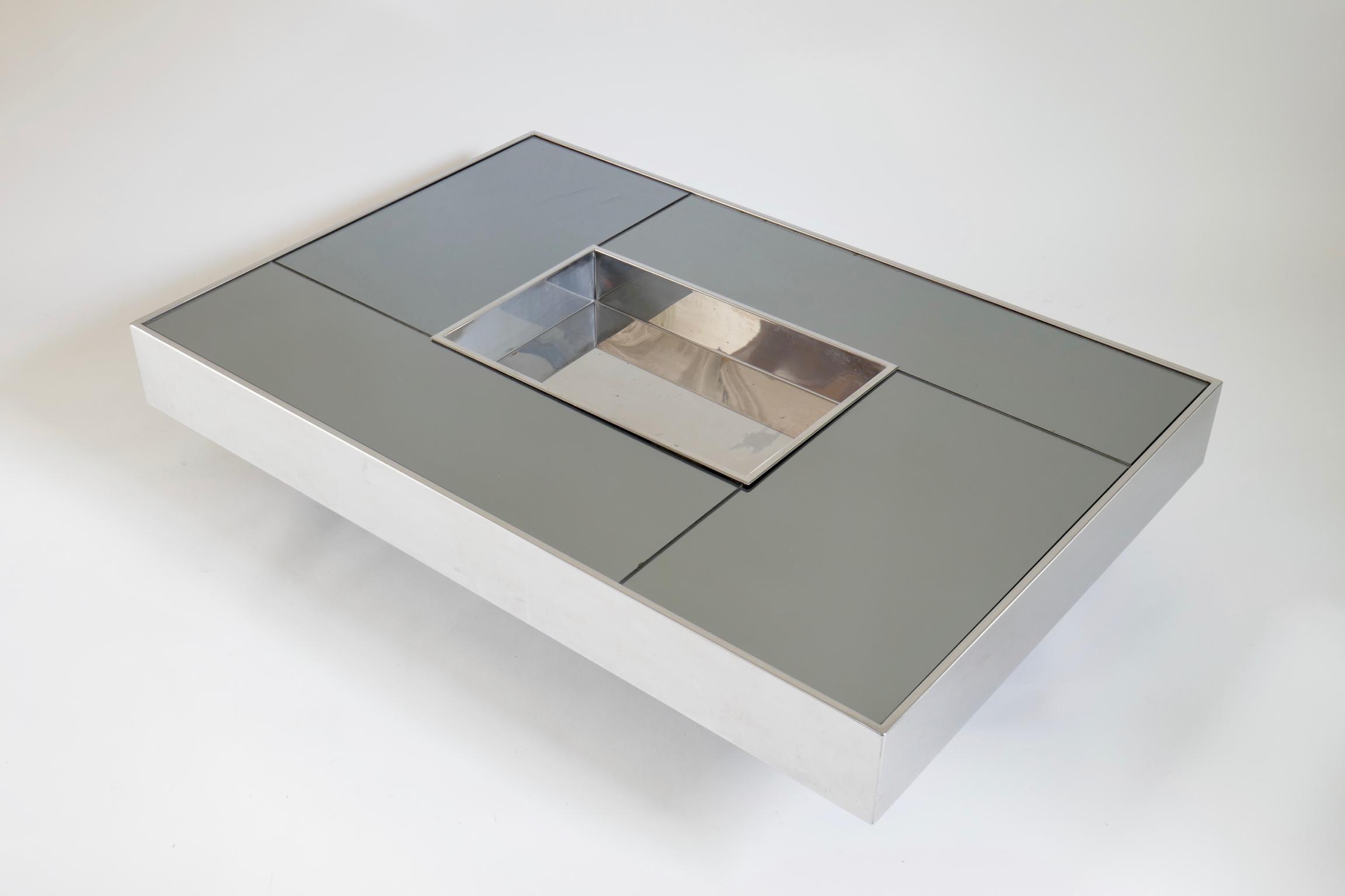 Stainless steel coffee table with smoked mirror top by Giovanni Ausenda, produced in 1970 by Ny Form Italy
Similar to a design by Willy Rizzo.