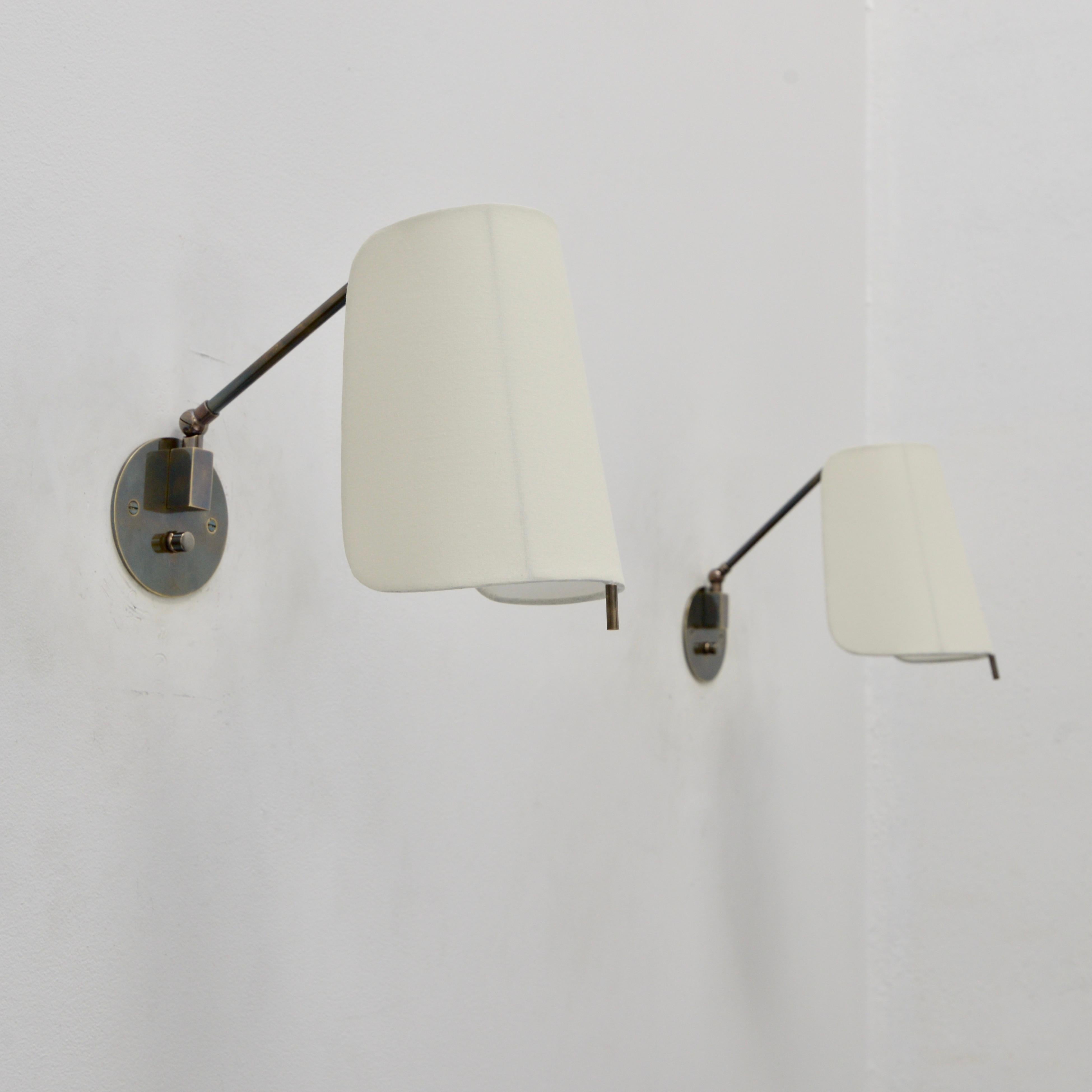 Part of Lumfardo Luminaries contemporary collection, the ShiLU Sconce is a fully Directional reading sconce crafted from patinated brass and steel hardware and fabric shade. Classic European Mid-Century Modern design made to order. This fixture can