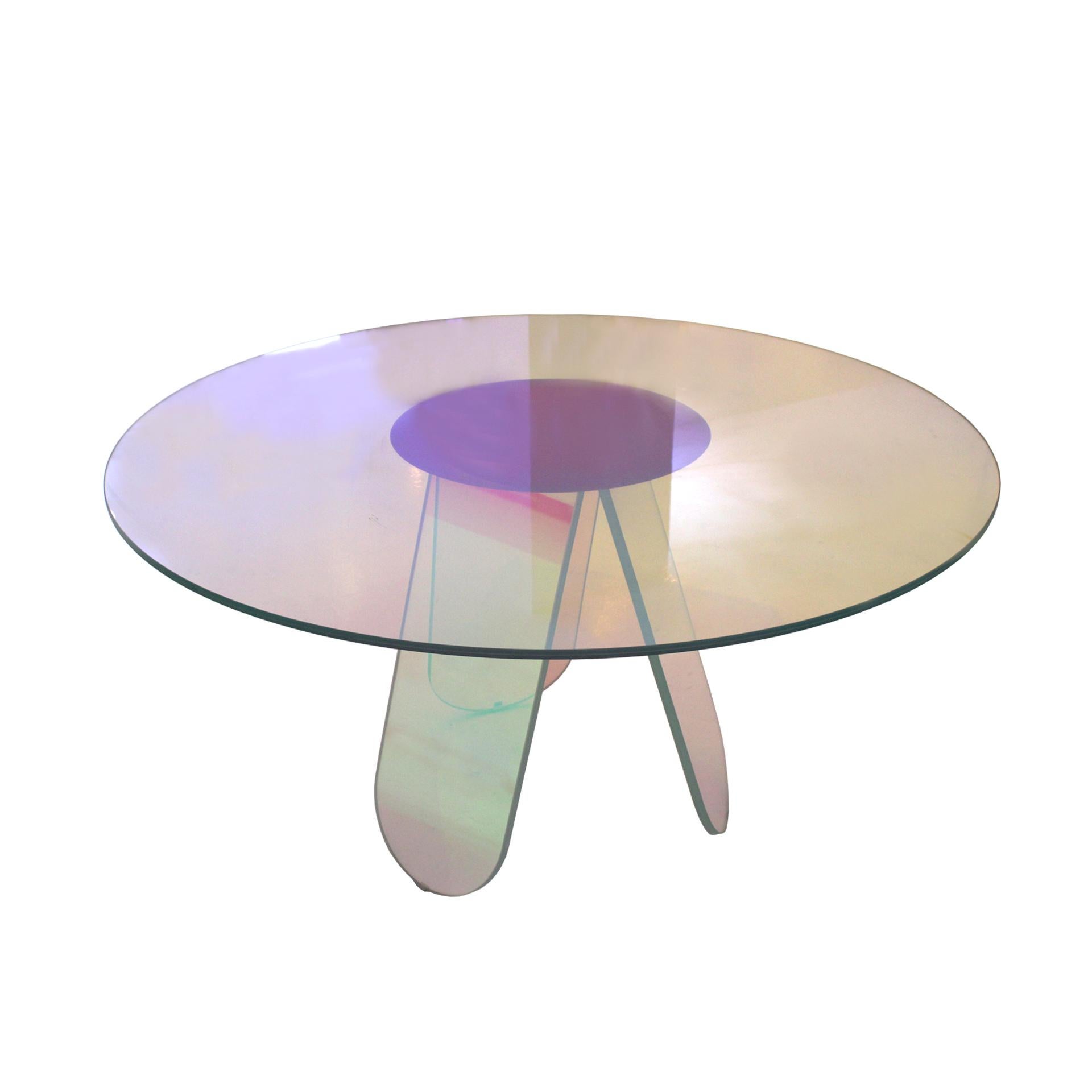 «Shimmer» table designed by Patricia Urquiola edited by Glas Italia. Made of laminated and glued glass with a multichromatic finish, whose coloration varies according to the angle of incidence of light and the point of observation.

Slightly