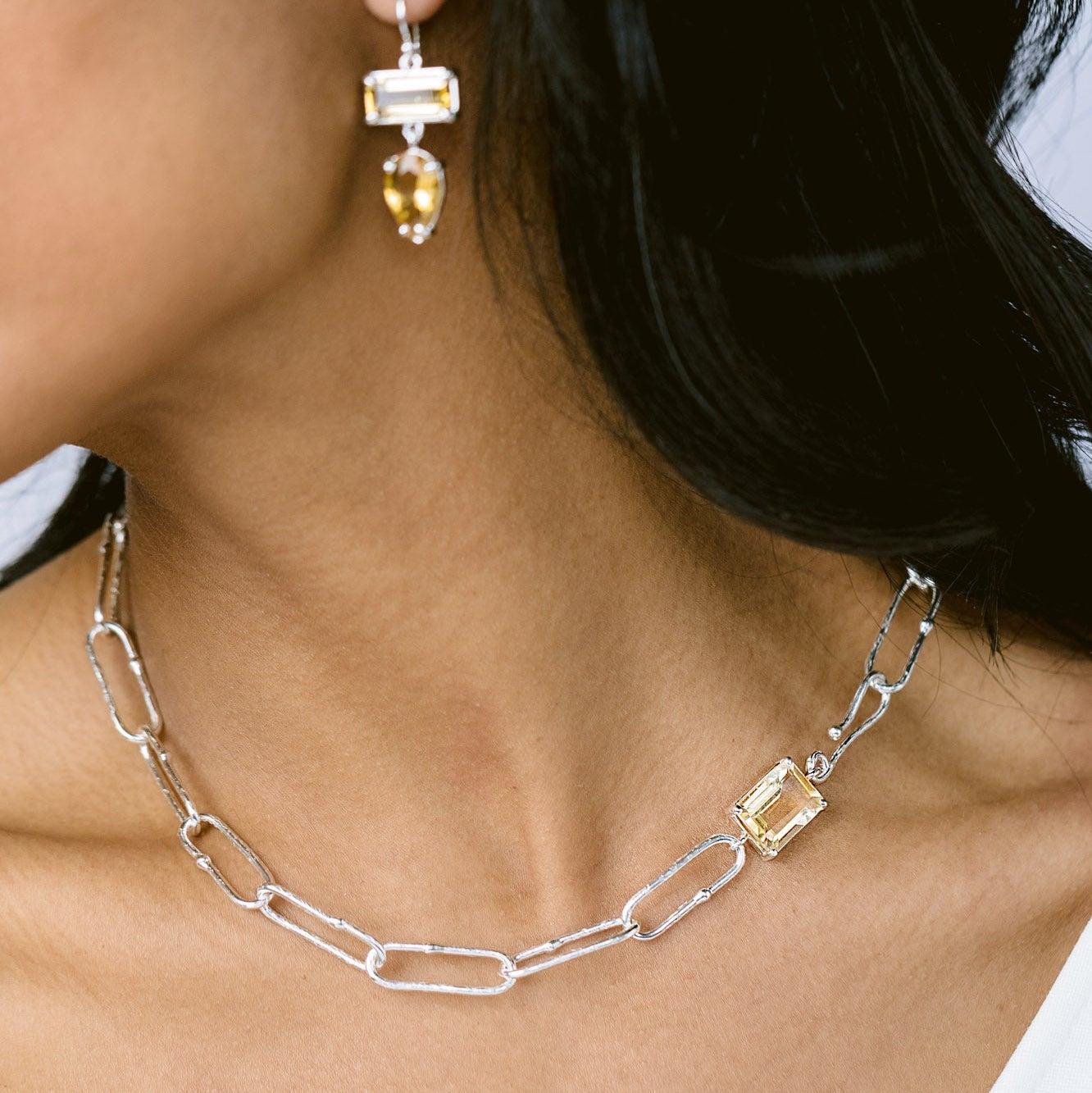 Intention: All Eyes on Me

Design: Multiple simple, understated ideas work well together in this timeless design. From the handcrafted links, to the citrine, to the self closing hook, it's hard to tell where the beauty of this choker begins and ends