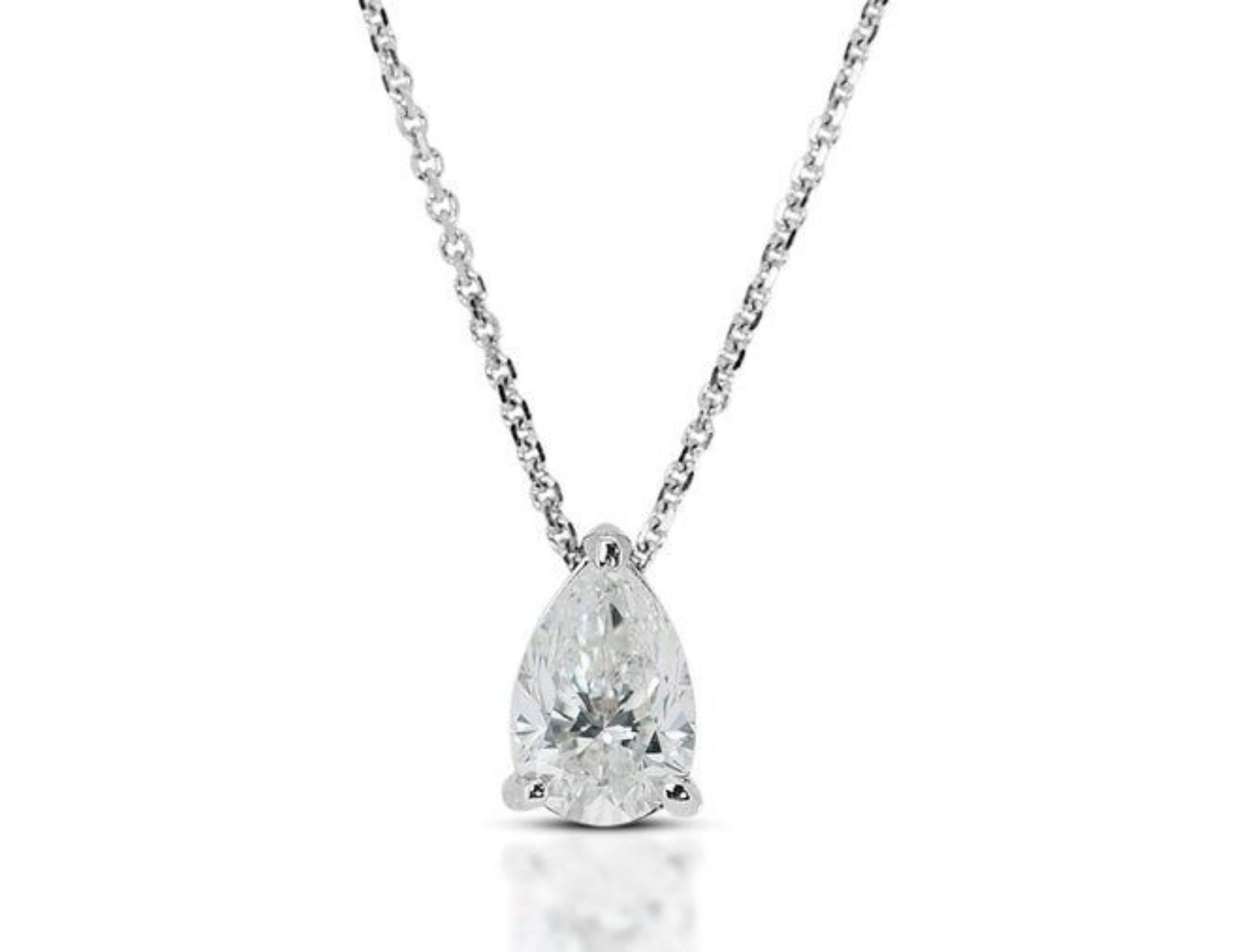 Shimmering 0.7 Carat Pear Brilliant Diamond Necklace in 18K White Gold (GIA Certified). This captivating necklace showcases a breathtaking 0.7 carat pear brilliant diamond, certified by the prestigious GIA (7471939615). The radiant H color and SI1