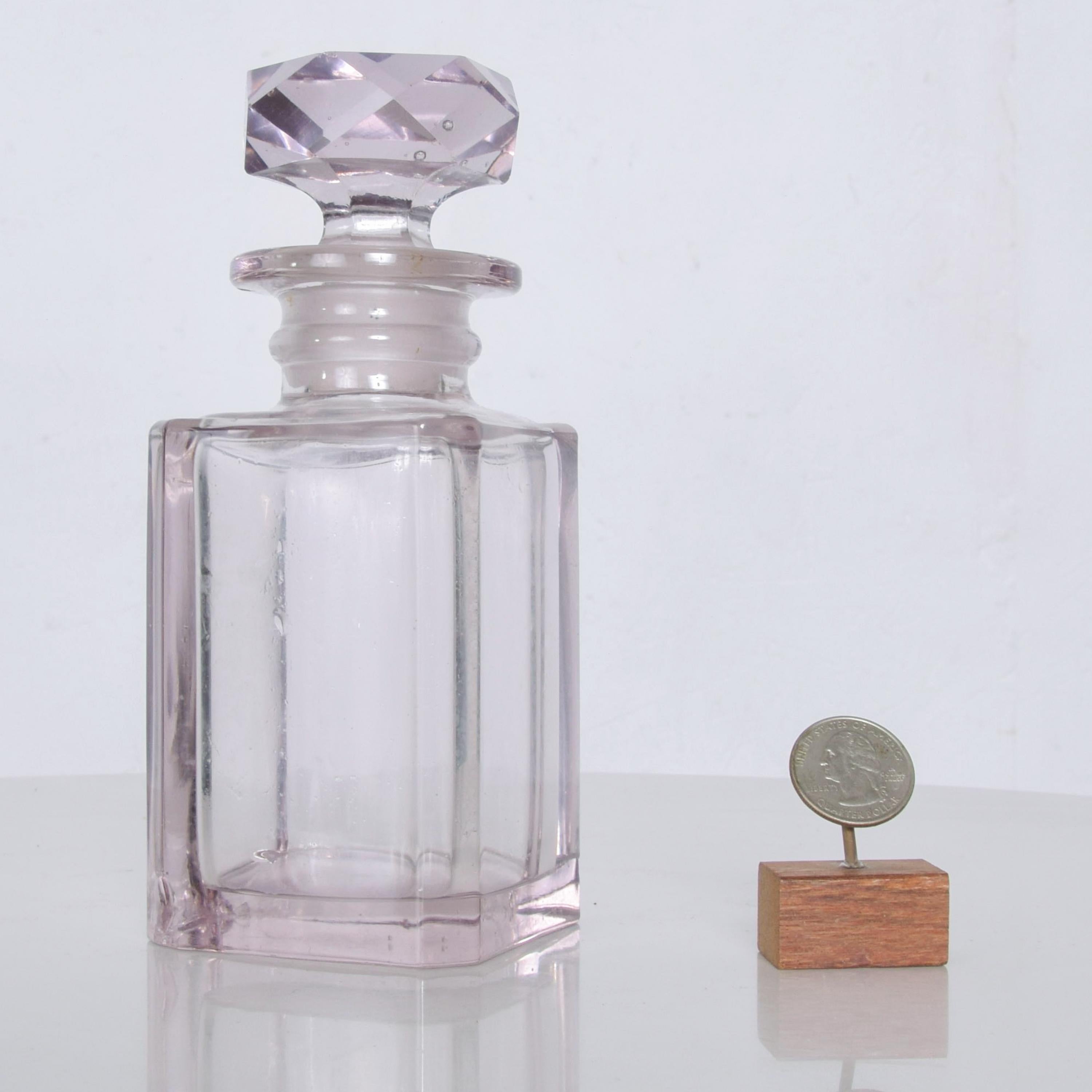 Lovely antique pale pink colored cut glass square perfume scent bottle in the style of Baccarat
Original unrestored vintage condition. With original faceted stopper. No maker stamp visible. Some nicks are present. Please review images. Dimensions: