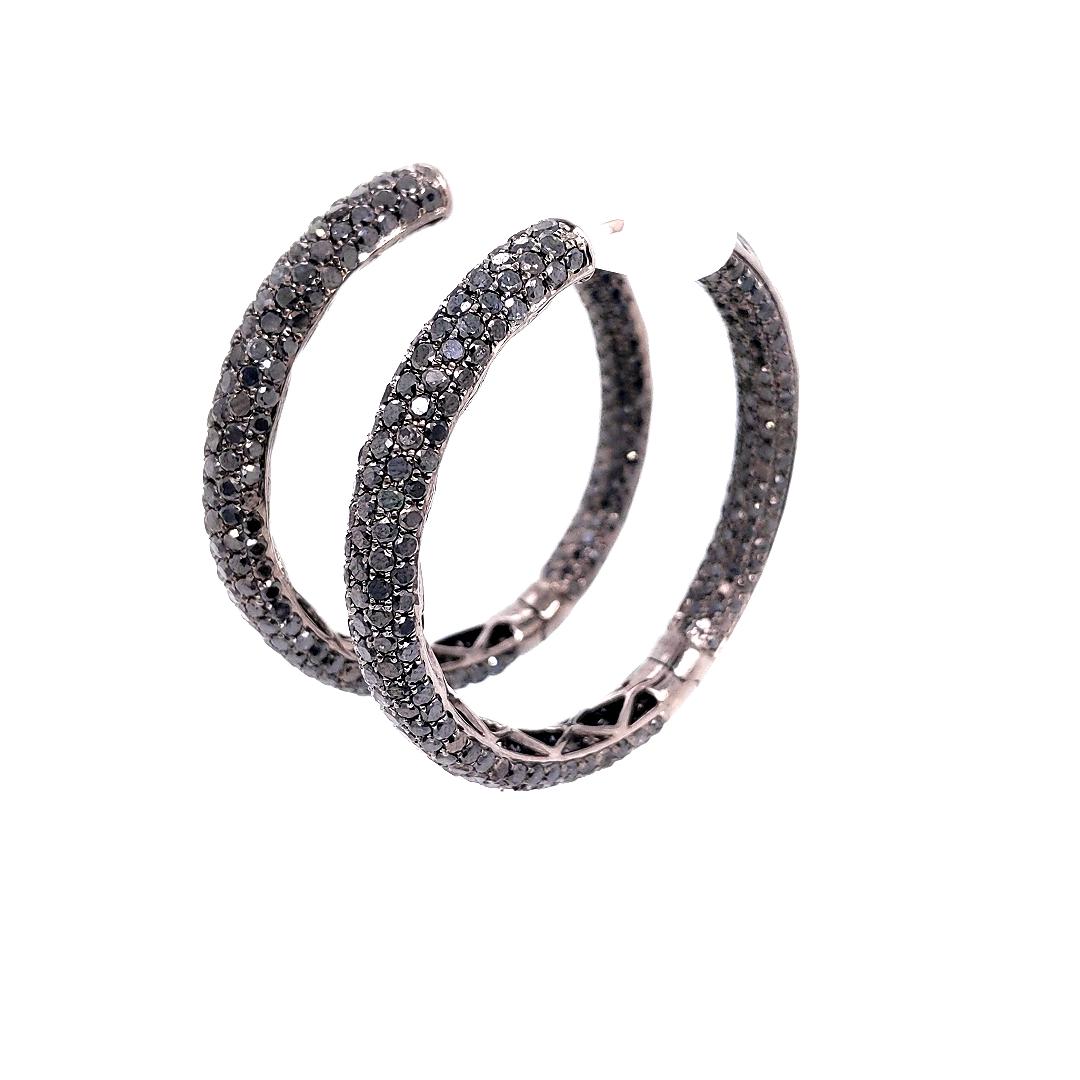 The Lightest Weight Micro Pave Diamond Hoop Earrings with Black Diamonds Inside and Out on all Three Sides set in 18K Black Gold. 

Diamond Breakdown:
572 Round Black Diamonds - Totaling 14.02 Carats
18K Gold - weighing 17.30 grams