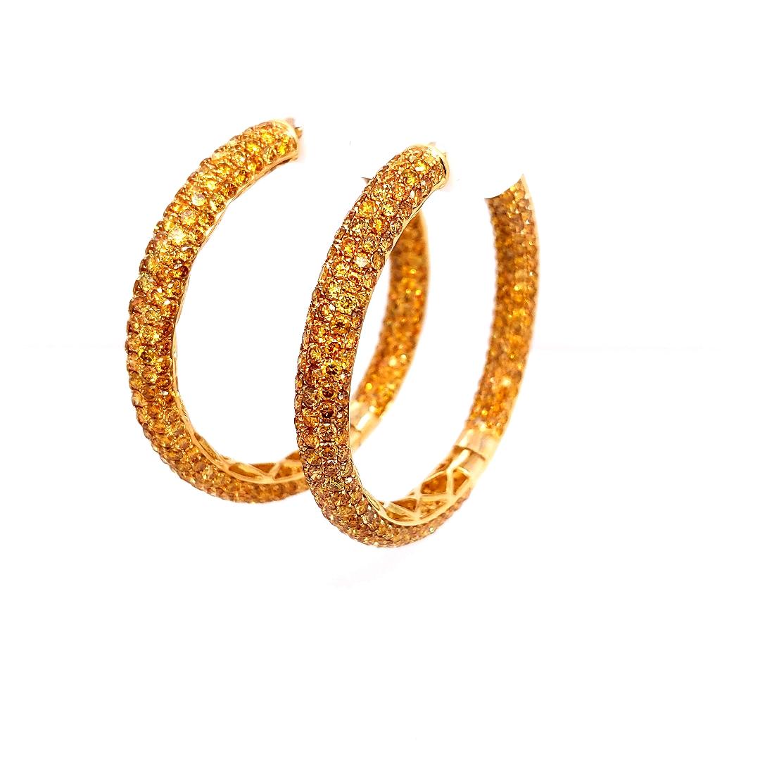 These stunning earrings crafted in yellow gold each features 286 Natural Fancy Yellow round brilliant cut diamonds set in beautifully detailed 18K gold.

Diamond Breakdown:
572 Natural Fancy Yellow Diamonds - Totaling 12.52 Carats
18K Gold -