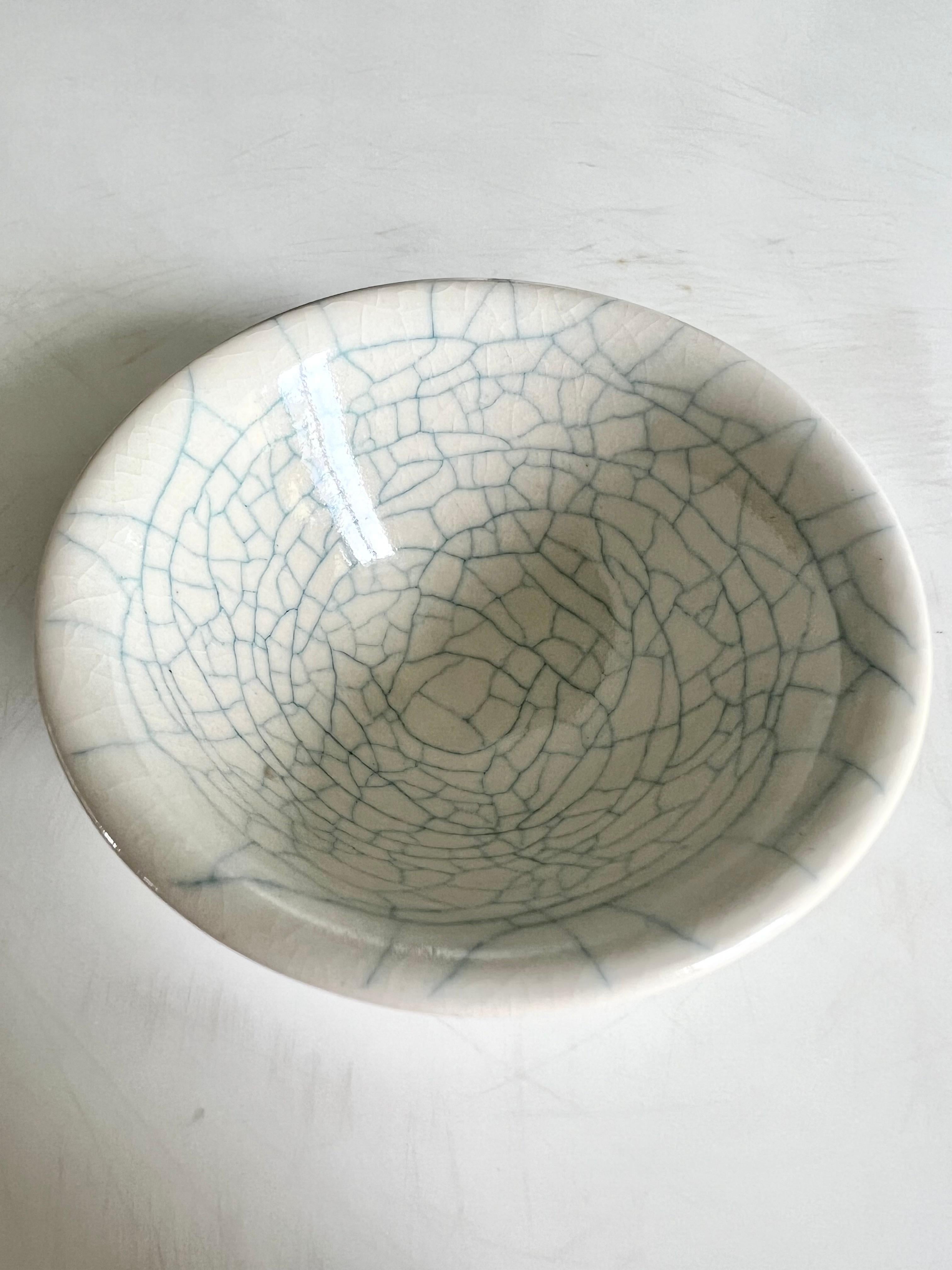 Ceramic 2
Ceramic
8.5cm in diameter, 3.9cm in height

Shin-Young Park is a Korean-born New Zealander who moved to Auckland with her family at 16, and to Singapore in 2006. She completed both her BFA in 1998 and MFA in 2003 at the Elam School of Fine