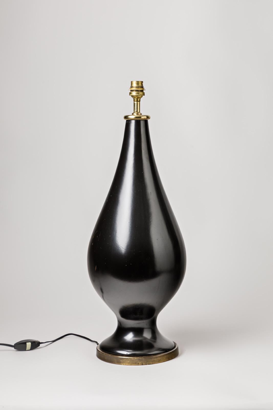 Important elegant shinny black ceramic table lamp

Midcentury black ceramic glaze color and modern form,

French production, circa 1950.
Excellent original condition.

Sold without lampshade.

Ceramic dimension: Height 48 cm, large 18