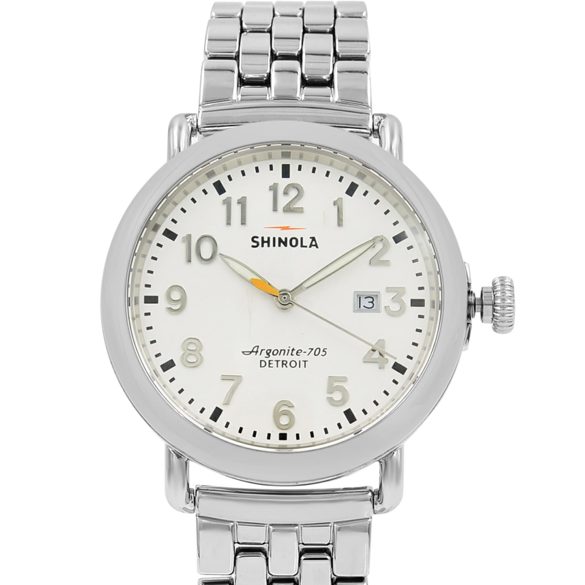 This pre-owned Shinola Runwell  10000054 is a beautiful men's timepiece that is powered by quartz (battery) movement which is cased in a stainless steel case. It has a round shape face, date indicator dial and has hand arabic numerals style markers.