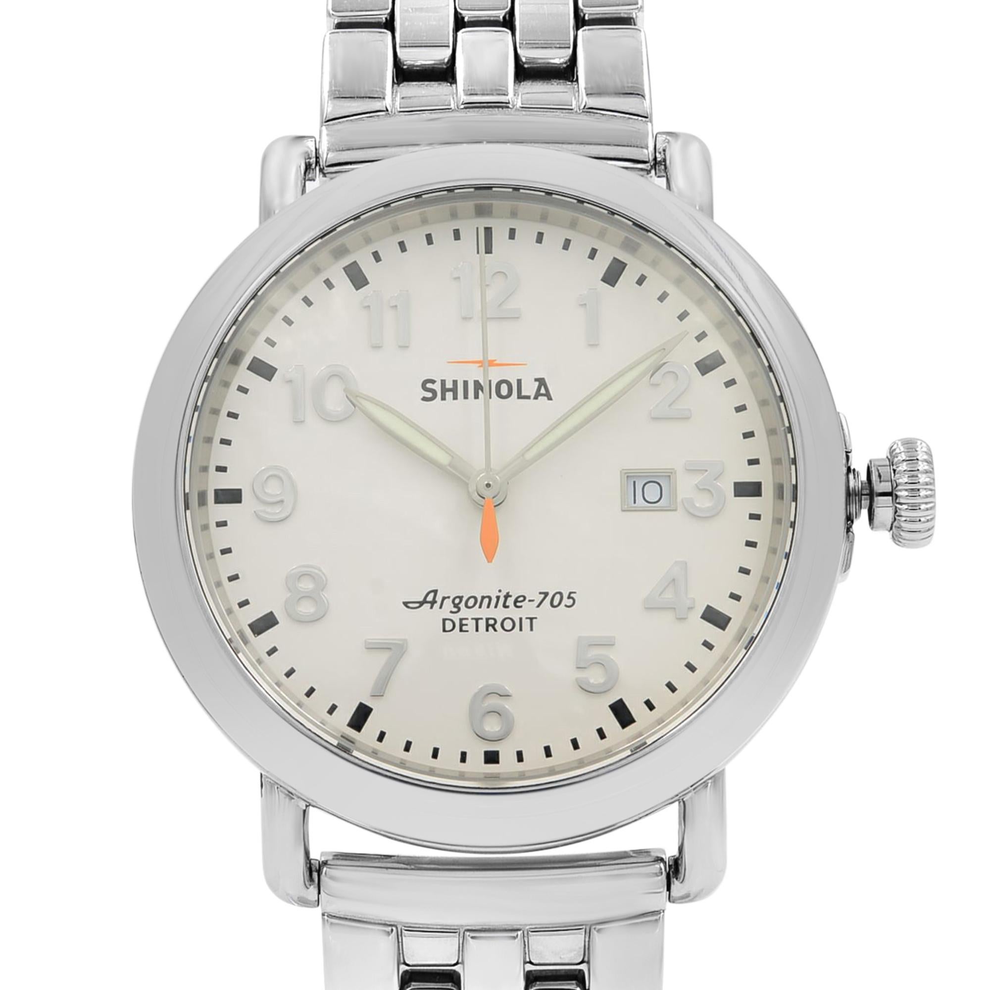 Pre-Owned Shinola Runwell 10000054 is a beautiful men's timepiece that is powered by quartz (battery) movement which is cased in a stainless steel case. It has a round shape face, date indicator dial and has hand arabic numerals style markers. It is