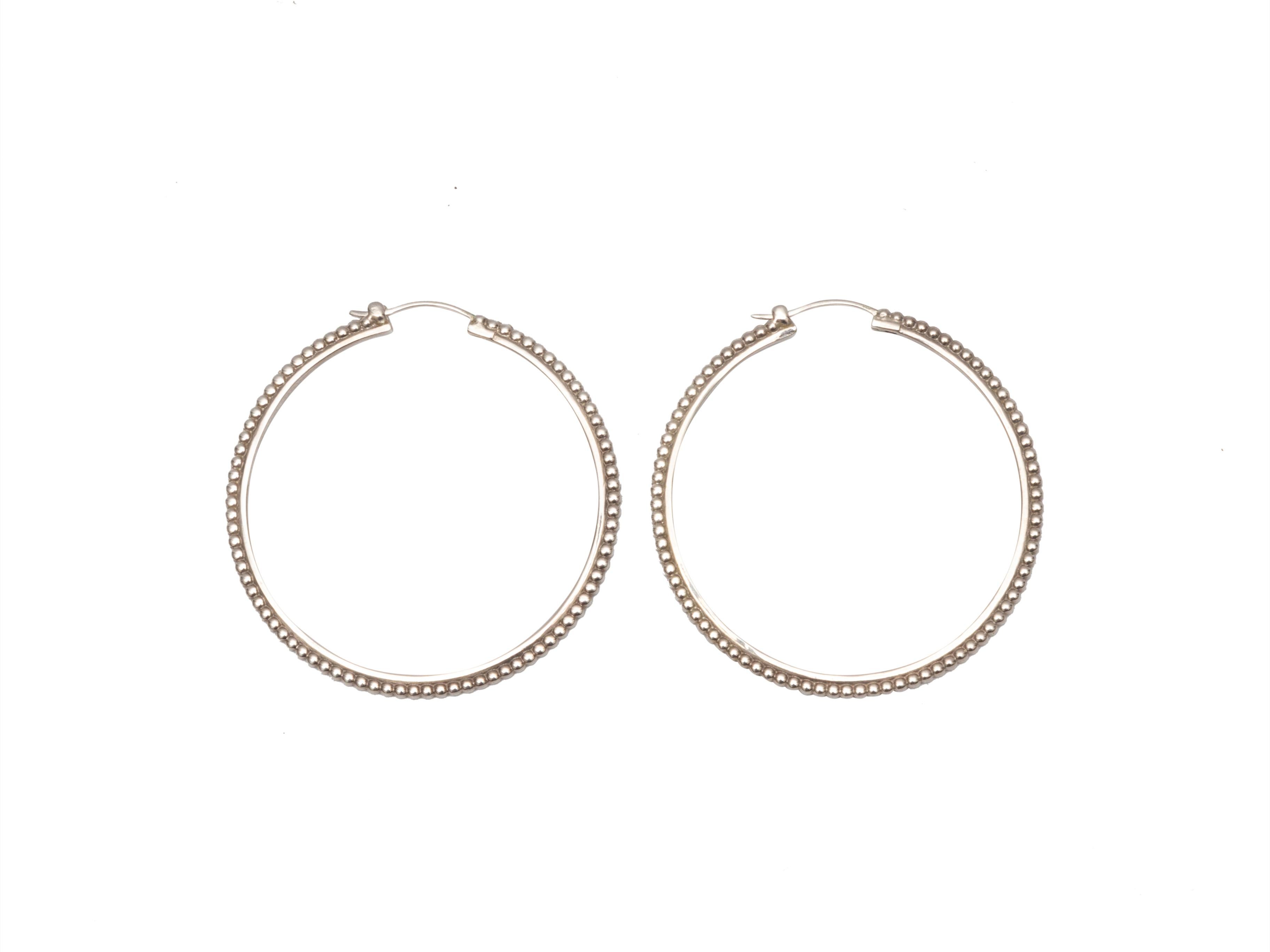 Product Details: Silver large pierced hoop earrings by Shinola. 2