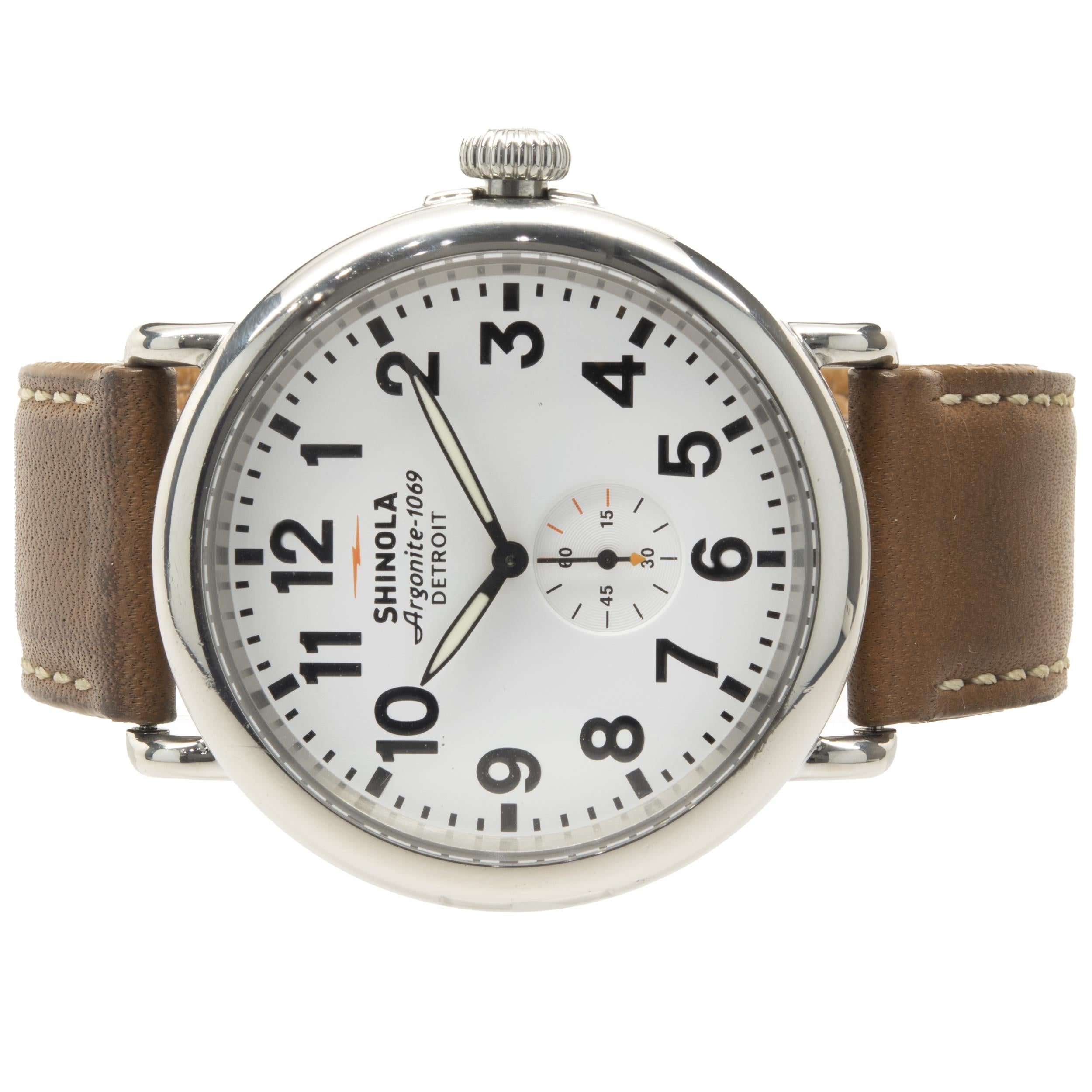 Movement: quartz
Function: hours, minutes, seconds
Case: 47mm round, smooth bezel
Bracelet: Shinola brown leather strap with buckle
Dial: white arabic dial, small seconds
Serial # S0100104XXX
Reference # 1069

Complete with original box and
