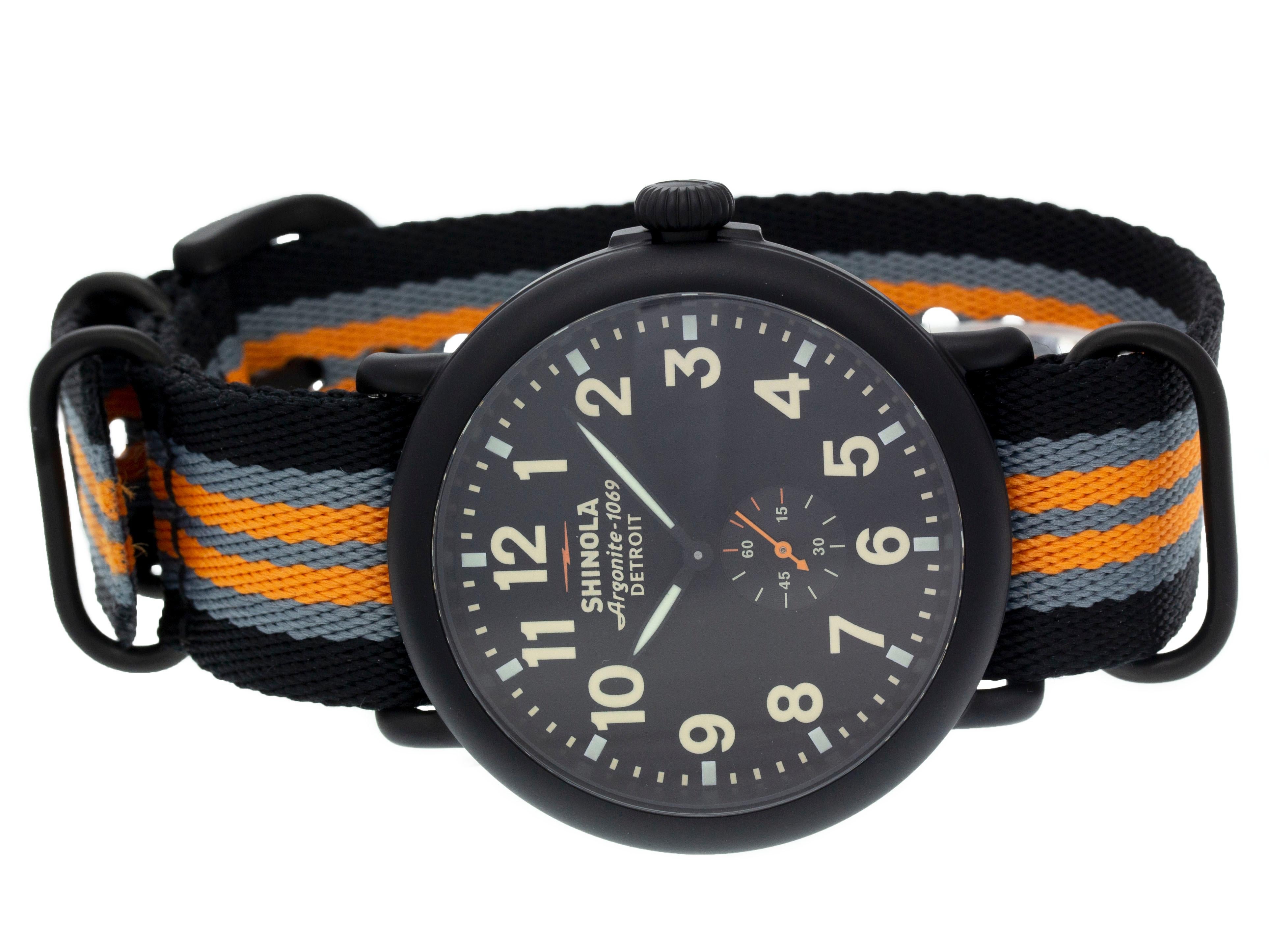 Black PVD steel Shinola The Runwell quartz watch with a 47mm case, black dial, and striped nylon strap with tang buckle. Features include hours, minutes, and seconds. Comes with a Deluxe Gift Box and 2 Year Store Warranty.​

Brand	Shinola
Series	The