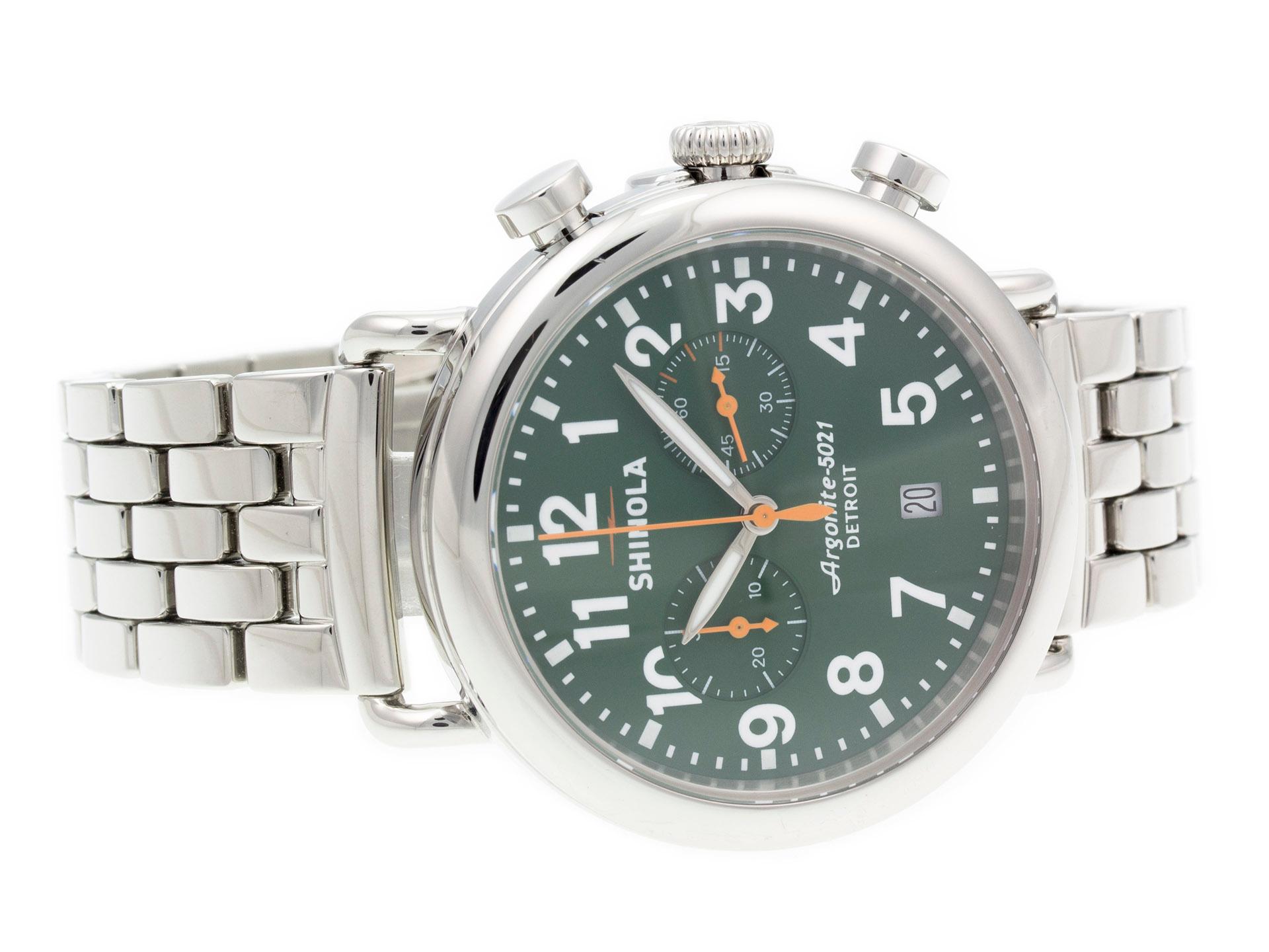 Stainless steel Shinola The Runwell Chrono 10000063 watch, water resistant to 100m, with date, chronograph, and bracelet.

Watch	
Brand:	Shinola
Series:	The Runwell
Model #:	10000063
Gender:	Men’s
Condition:	Great Display Model, Light Scratches on