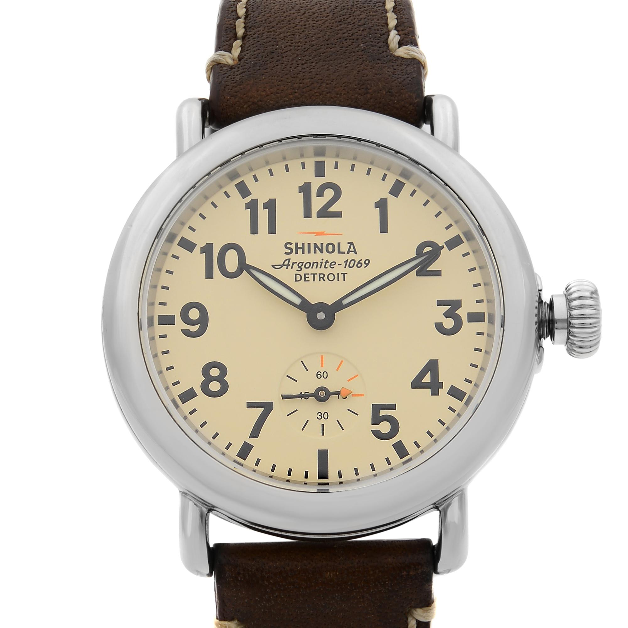 This pre-owned Shinola The Runwell S0200053 is a beautiful Ladie's timepiece that is powered by quartz (battery) movement which is cased in a stainless steel case. It has a round shape face, small seconds subdial dial and has hand arabic numerals