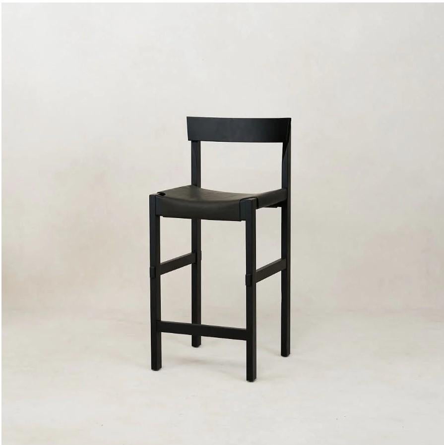 The Shinto Bar Stool was designed as an ode to the traditional Japanese Torii Gate found at the entrances of Shinto shrines. The stool invites you to pause, find peace in the moment and come together with friends and family around the dining
