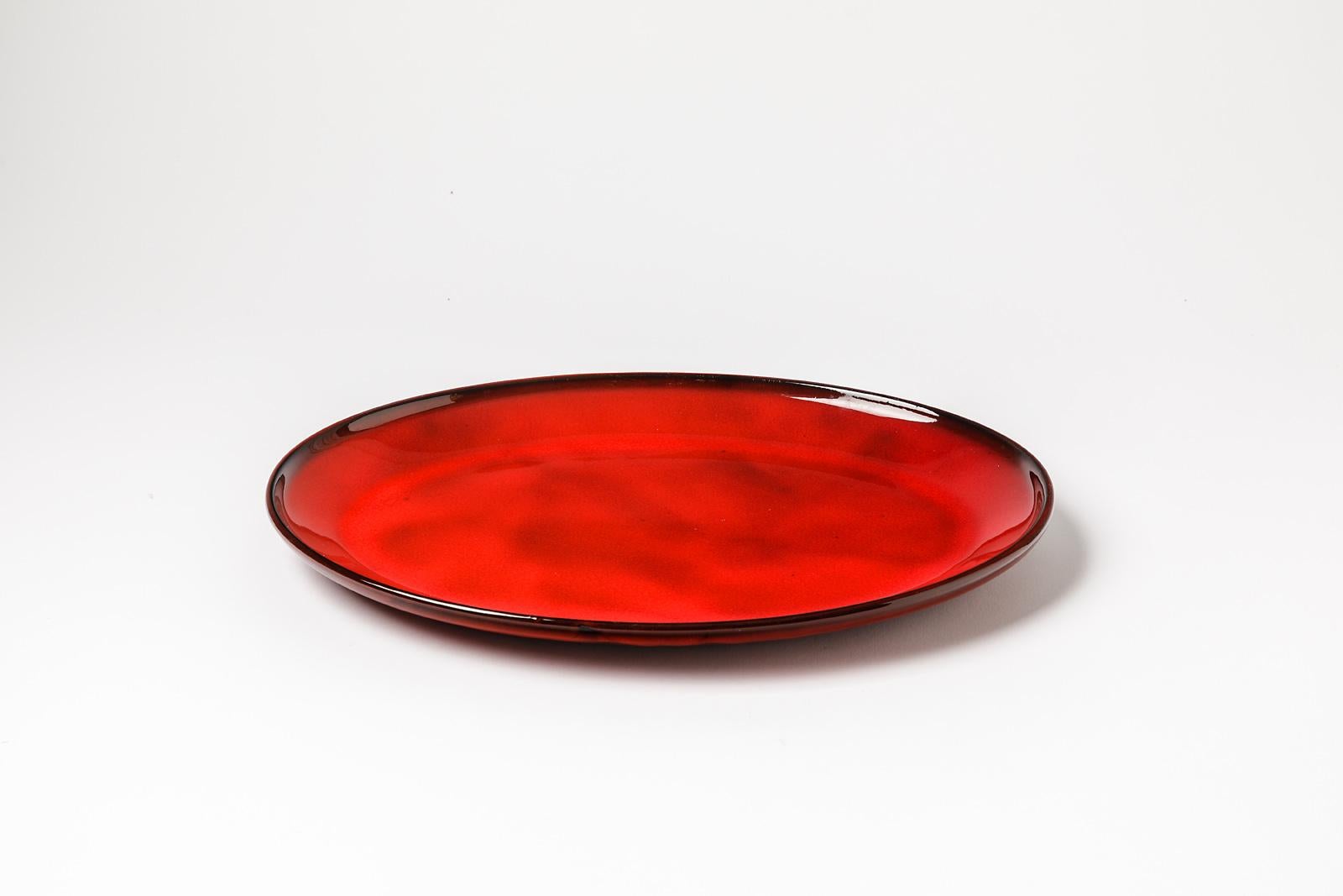 Gerard Hofmann

Realised in vallauris circa 1950

Original and large shiny red ceramic plate

Original perfect condition

Signed under the base

Measures: Height 3 cm Large 35 cm Width 25 cm.