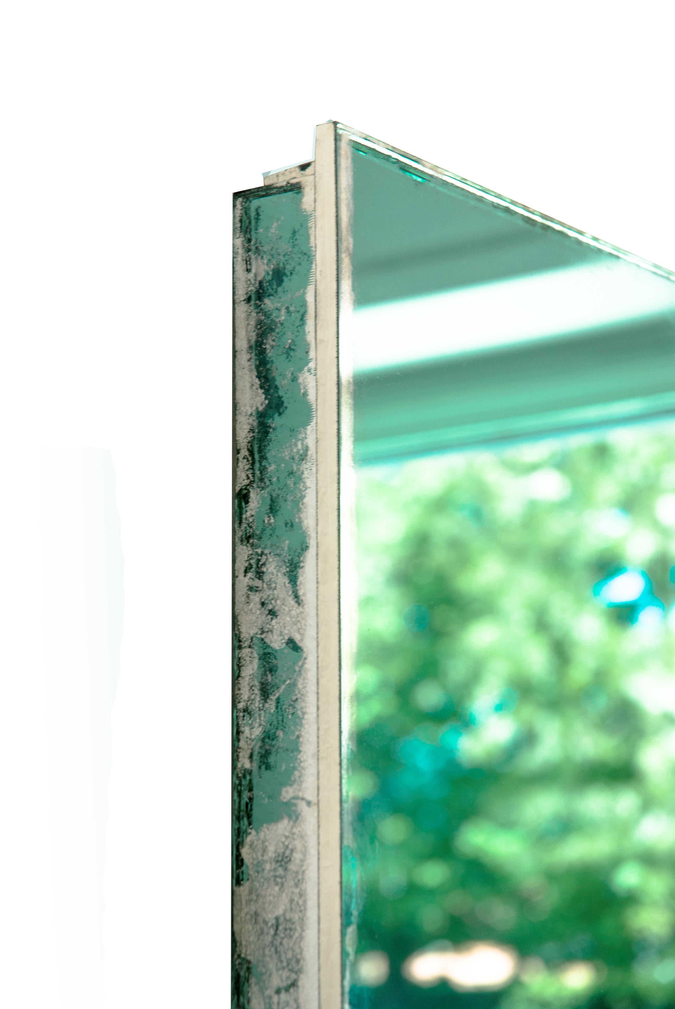SHINY

This sculpture mirror is a work of contemporary art, entirely made by hand in Tuscany, Italy, 100% of Italian origin. 
Pure elegance for this bright mirror, one glass plate artfully silvered, hammered at the external edges, to create a wall