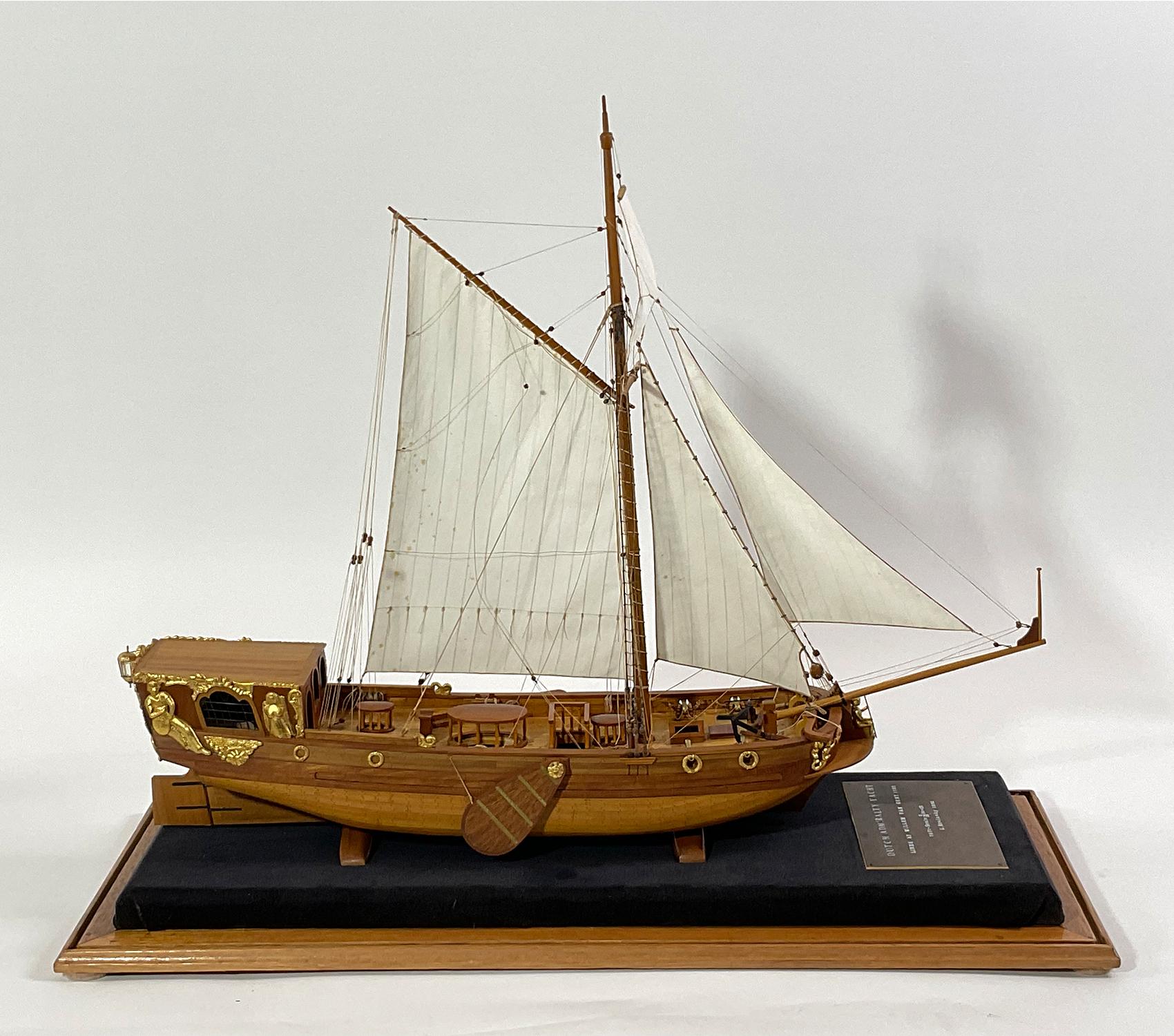 Plank on frame museum quality model of a Dutch Admiralty Yacht. Planks are pinned to the frames. Expertly rigged. Turned brass cannon. Gilded carvings adorn the stern quarters and other areas. Mounted into a custom case with black linen base. Circa