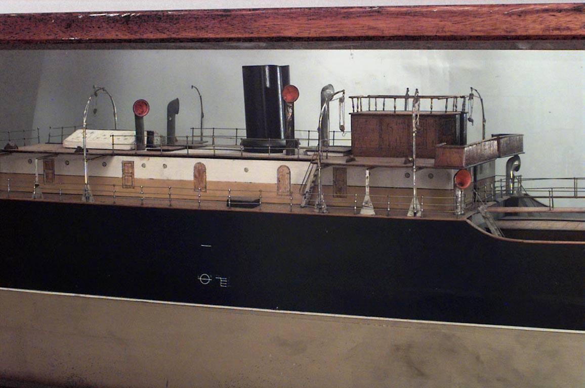 Ship model of black and gold painted half hull in oak and glass case (ROKER, built by Short Bros., 1898)
