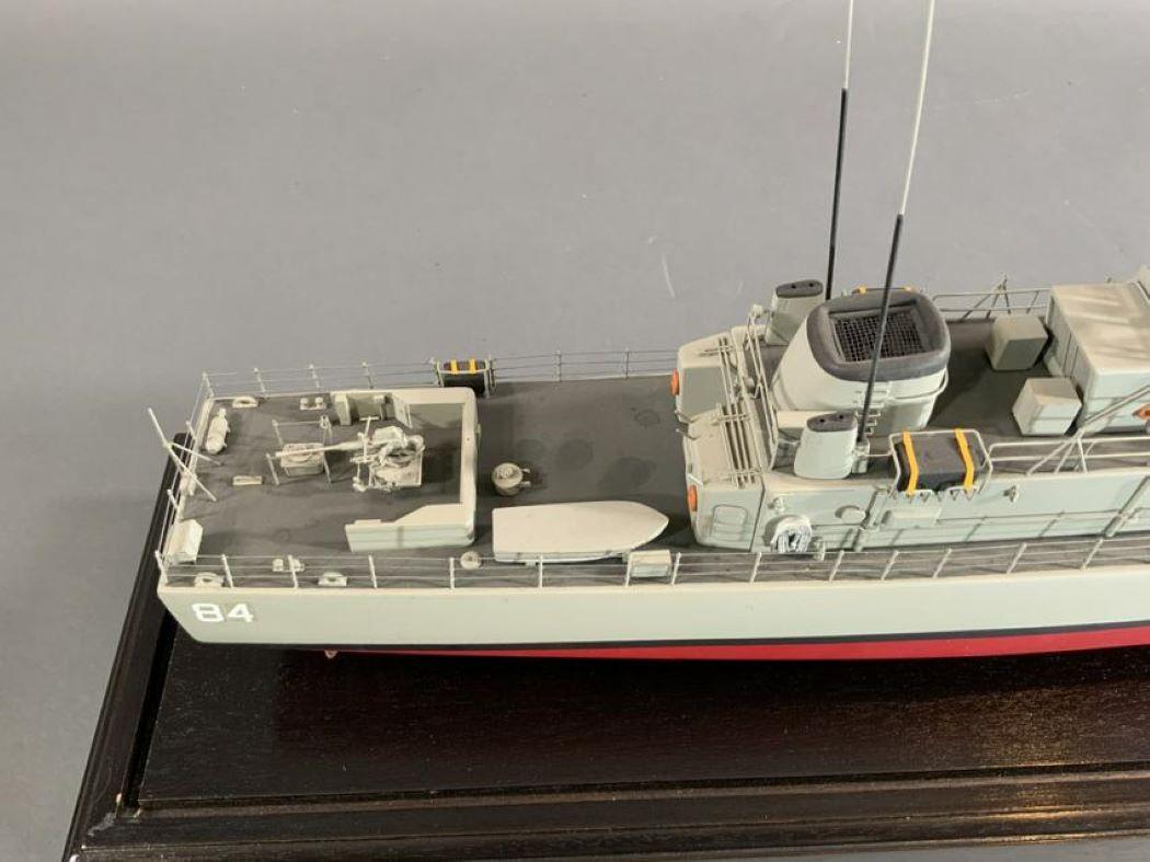 Model of the USS Ashville PG-84. This was a class of high speed gunboat. Commissioned in 1966 and later used in the Vietnam War. Built by the Tacoma Boatbuilding Company. The model is highly detailed with all Armament. mounted into a glass case.