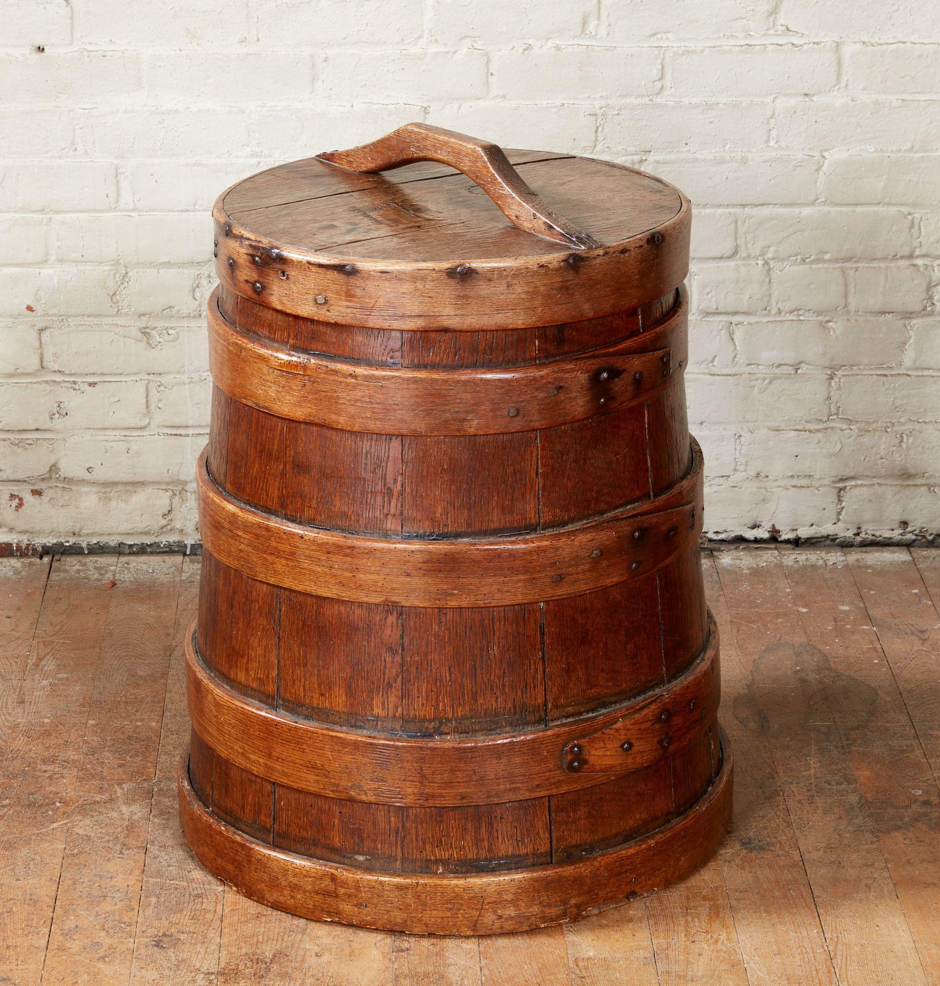 A large and impressive original HMS oak and ash biscuit barrel from an English ship of the line dated in rosenailing 