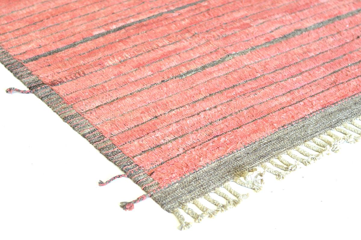 Shipca is a handwoven luxurious wool rug with timeless embossed detailing. In addition to its neutral earth-toned flat weave, Shipca has a beautiful coral rose shag that brings a lustrous and exciting feel to one's space. The Haute Bohemian