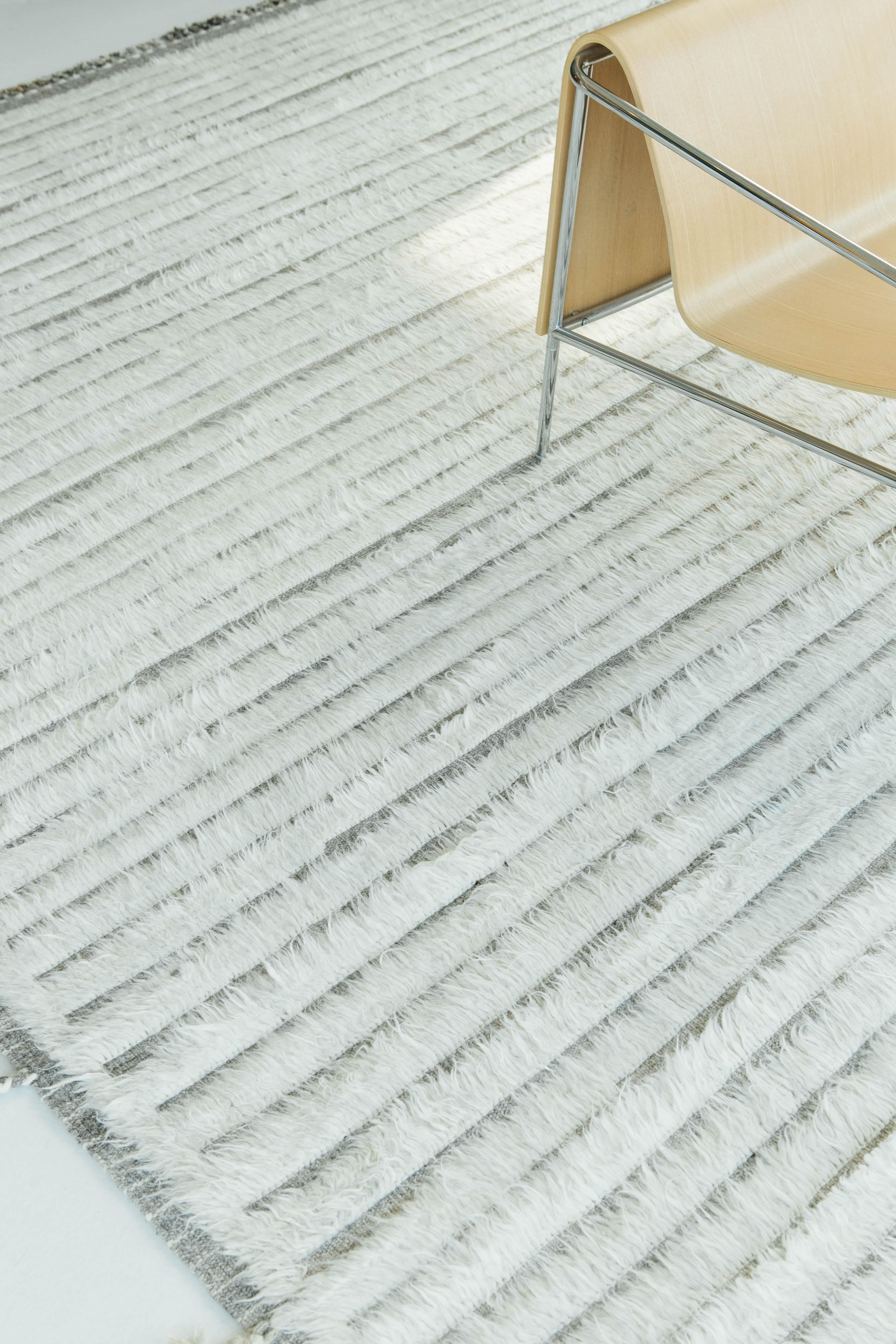 Shipca is a handwoven luxurious wool rug with timeless embossed detailing. In addition to its neutral earth-toned taupe flat weave, Shipca has a beautiful ivory shag that brings a lustrous and contemporary feel to one's space. The Haute Bohemian