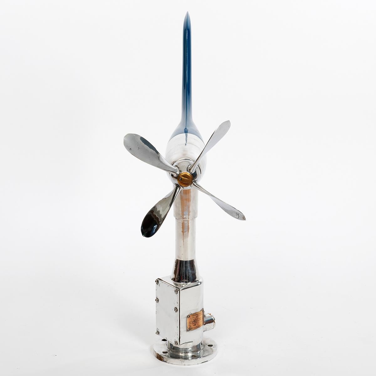 A ship's anemometer and aerovane originally mounted on the top of a container or large ship, where it would be connected to two dials on the bridge to indicating wind speed and direction. Now a stunning sculptural piece, the body and propeller blade