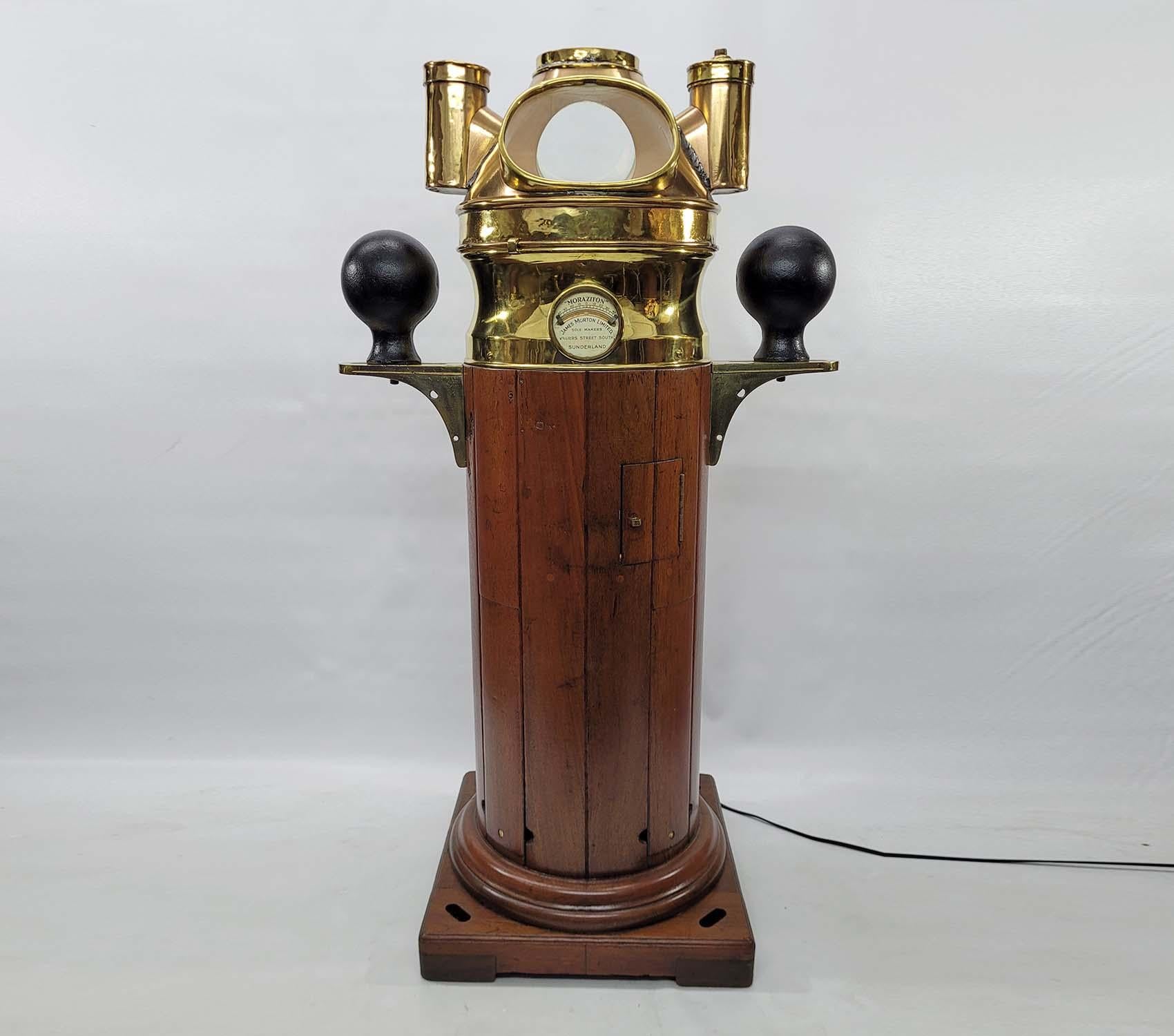 Exceptional ships binnacle by James Morton Limited of Sunderland. This is the “Capitalize Morabiton” model. A clinometer is fitted into the mermaid’s waist style compass shroud. The original compass hangs from davits inside. Varnished base with