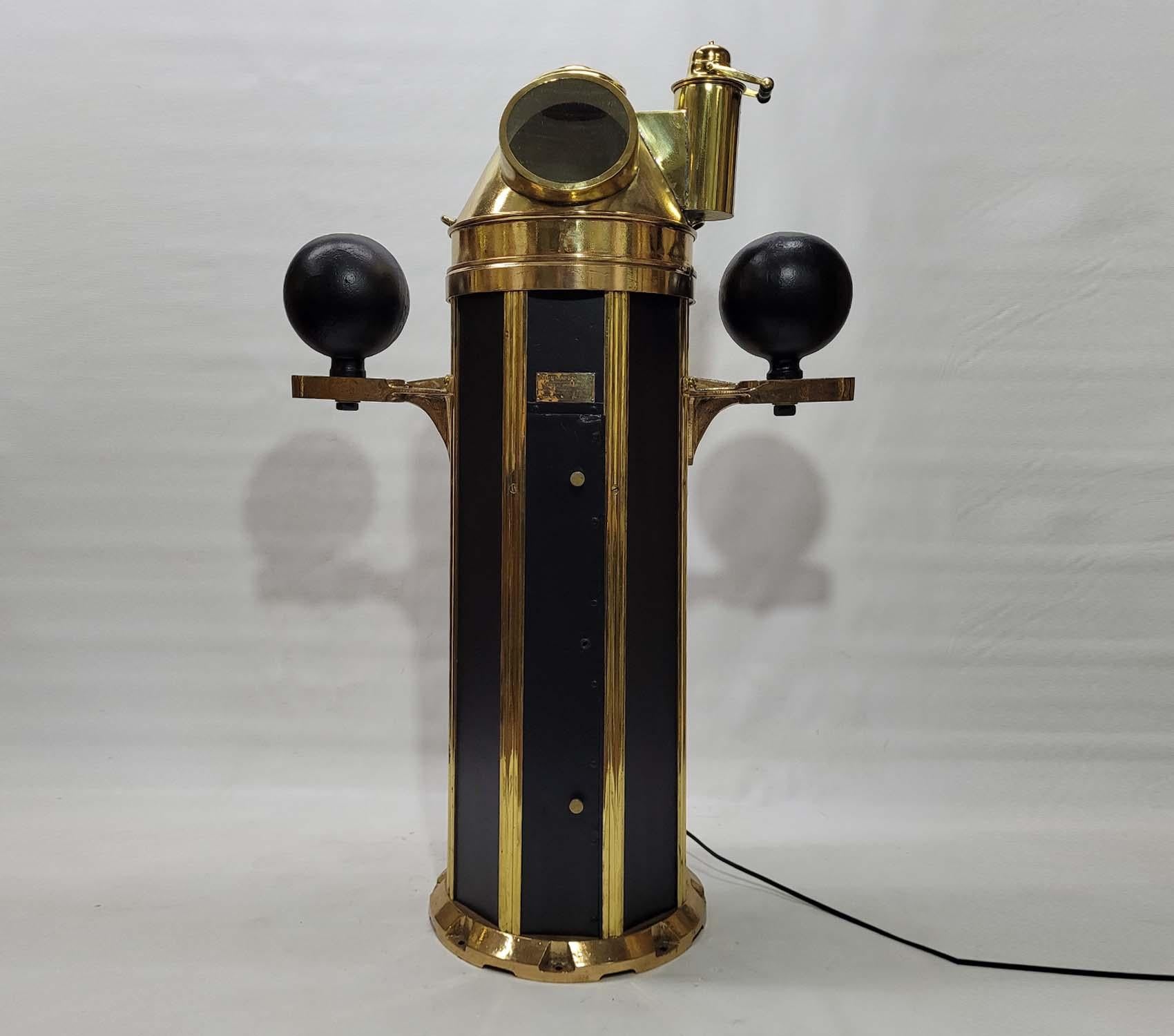Unique style marine binnacle by American maker John Hand and Son of Philadelphia. With polished and lacquered brass hood, compass, base trim, and rarely found wide brass strips on base. The compensating ball brackets are also polished and lacquered