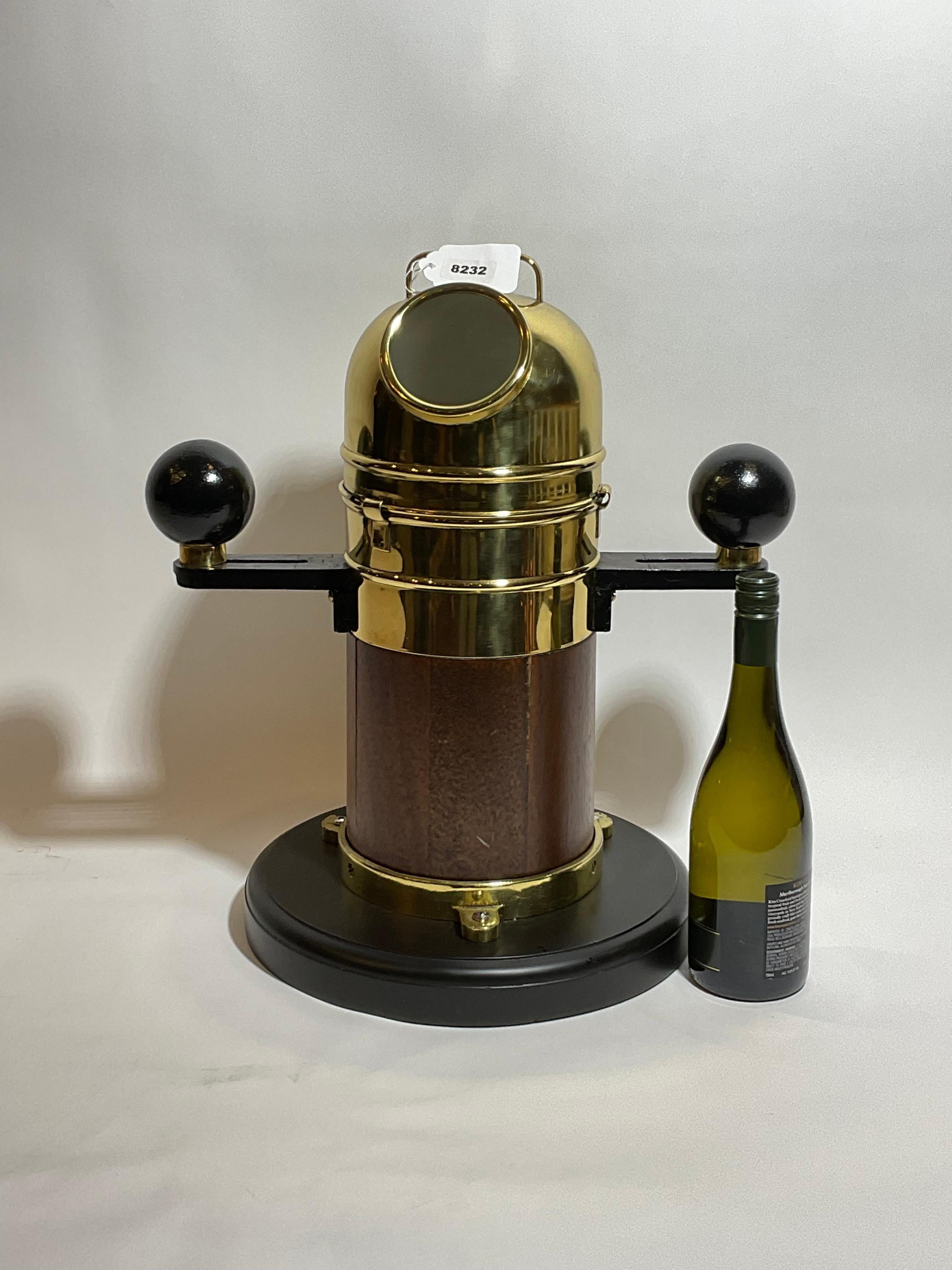 Small boat binnacle with wood base, brass compass ring and hood. Compass is engraved 