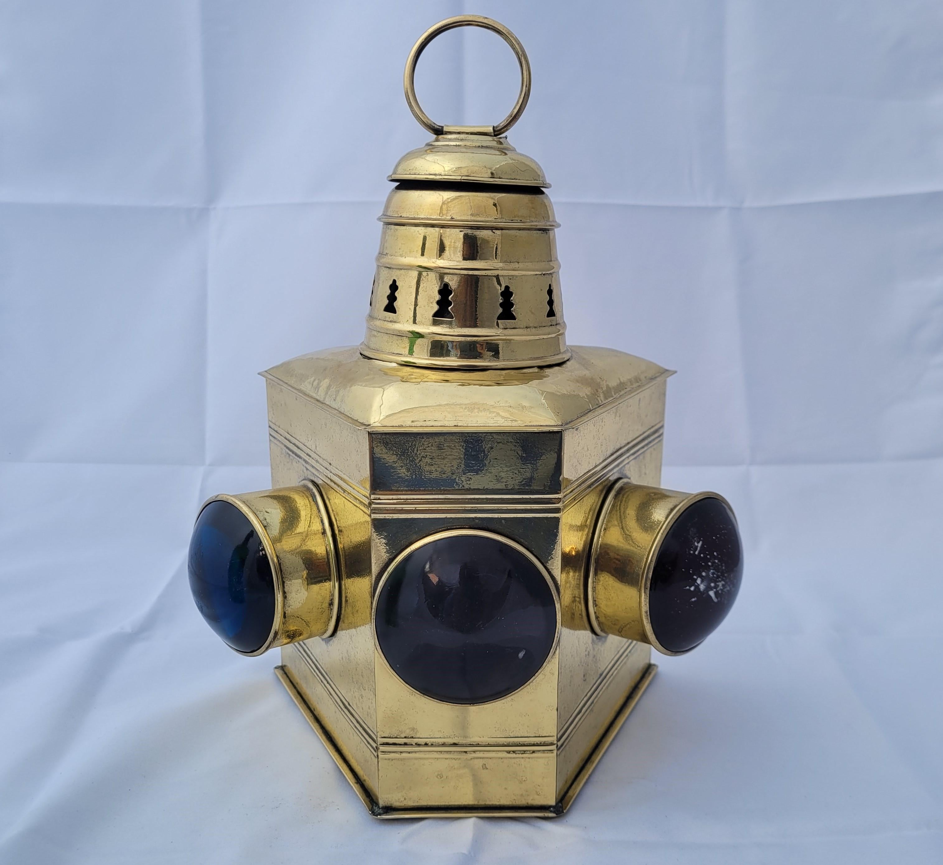 Ships bow lantern from a yacht. Marine lantern with three lenses, clear, port, and starboard. This is a rare piece from the early twentieth century. Vented top and carry ring. With oil tank and wick

Weight: 3 lbs.
Overall Dimensions: 12