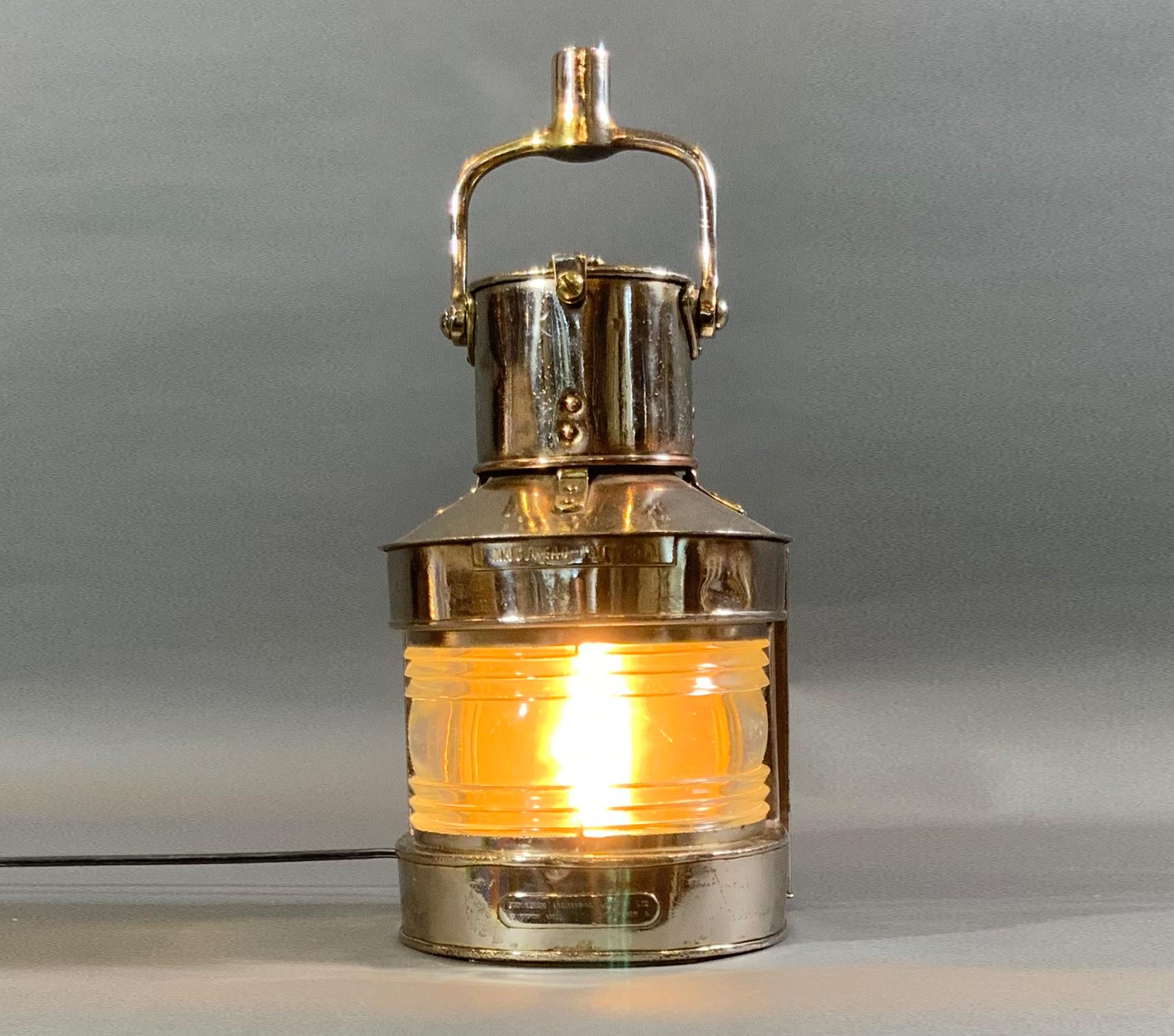 Polished steel ships masthead lantern by English maker. Fitted with a Fresnel glass lens. Lantern is wired. Vented top and hoisting handle.

Weight: 8 LBS
Overall Dimensions: 12” H x 8” L x 8” D
Made: England
Material: Steel
Date: Circa 1950.