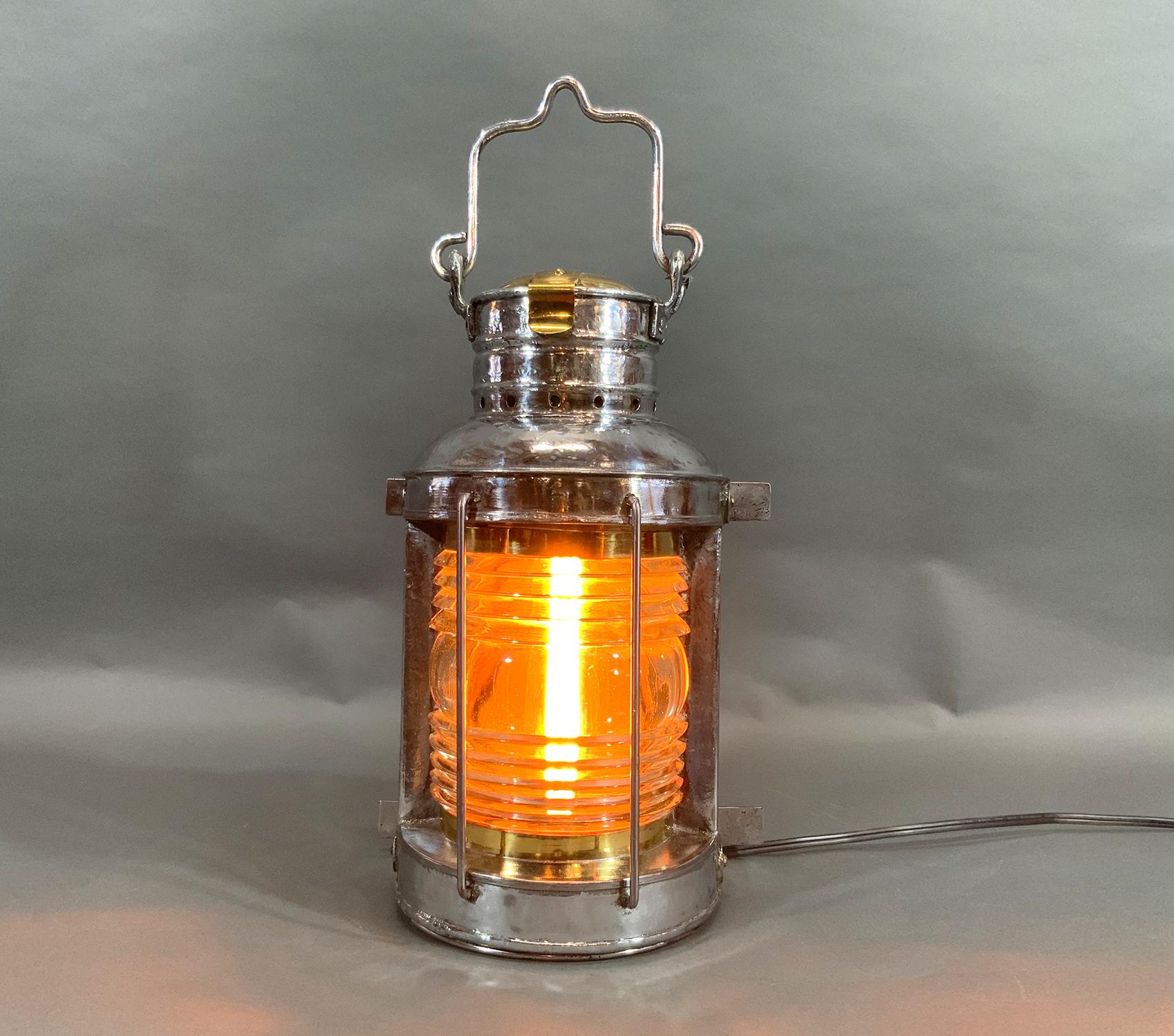 Ships masthead lantern with Fresnel glass lens, hinged door, Fresnel glass lens, hinged brass cap and protective steel bars. Wired with a power cord. 

Weight: 9LBS
Overall Dimensions: 14” H x 10” L x 7” D
Made: American
Material: Steel
Date: