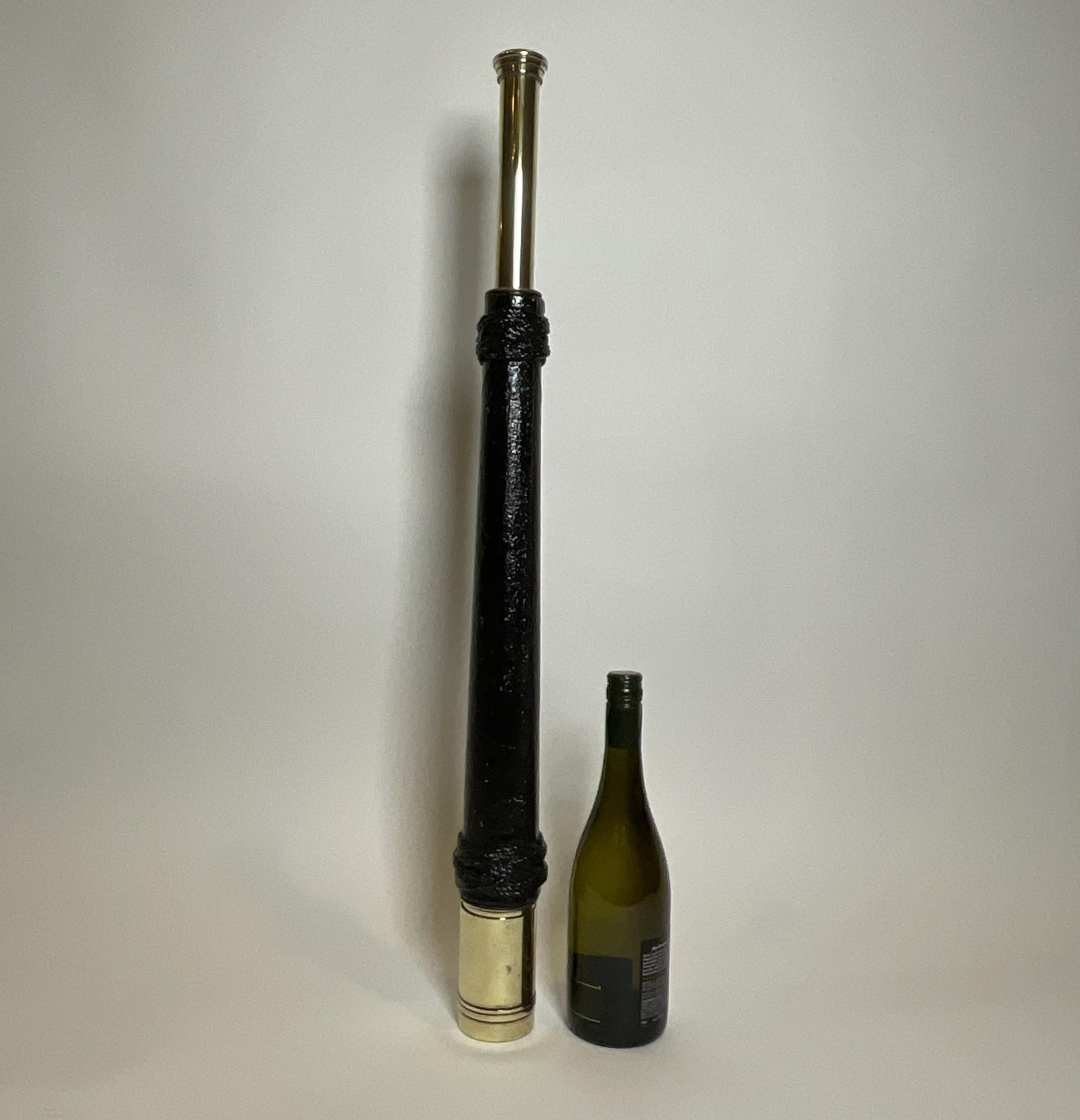 Early twentieth century ships telescope with a leather and rope wrapped barrel. Single focal tube is engraved Hughes and Son Ltd. London EC3. Circa 1920. Barrel end is fitted with a sunshade shroud.

Weight: 4 lbs.
Overall Dimensions: 30