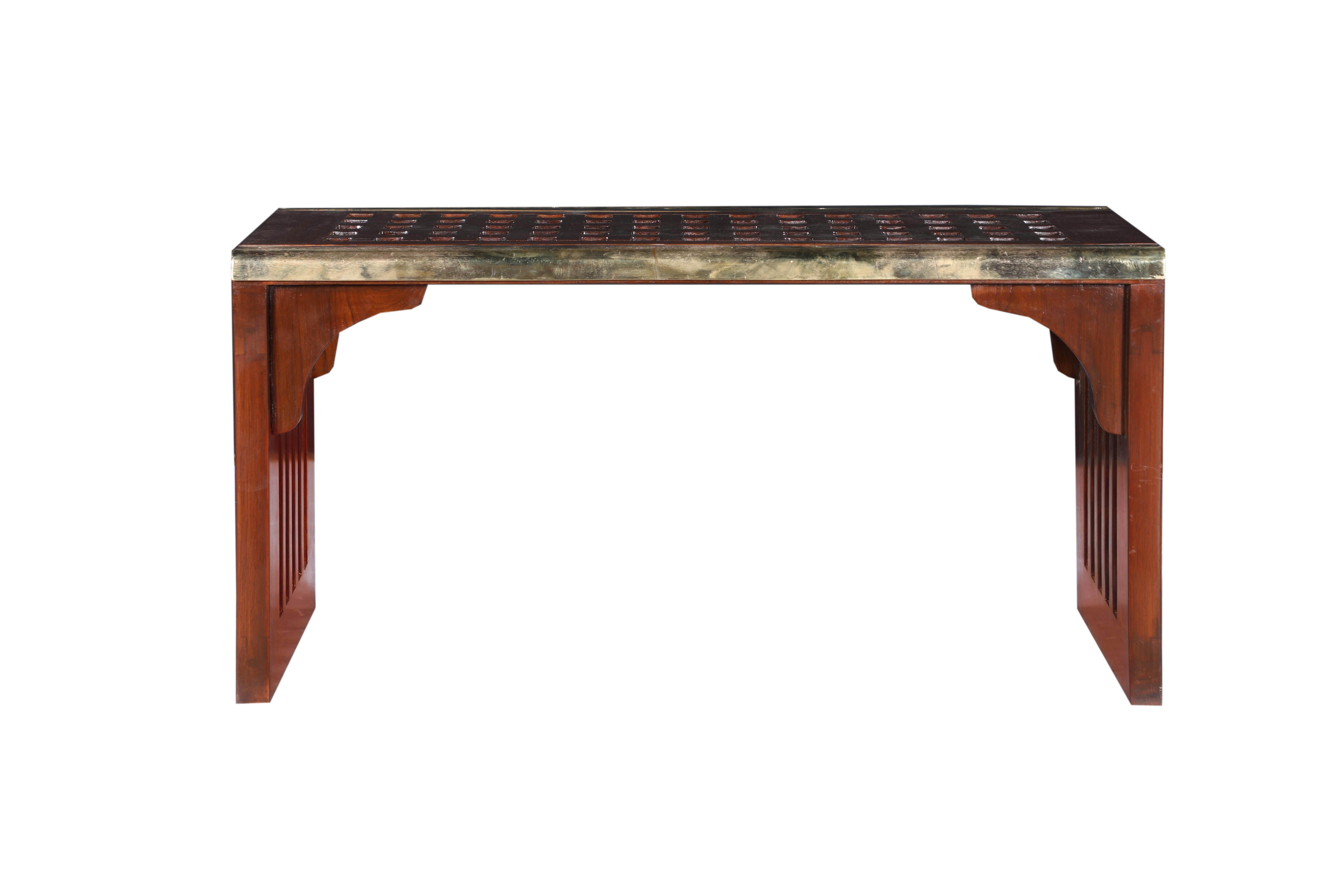 This table or bench is original teak decking from a large, decommissioned ship. Deborah Lockhart Phillips designed the piece to use as a coffee table or bench and incorporated old brass textured stair treads along the two long sides. Also done as a
